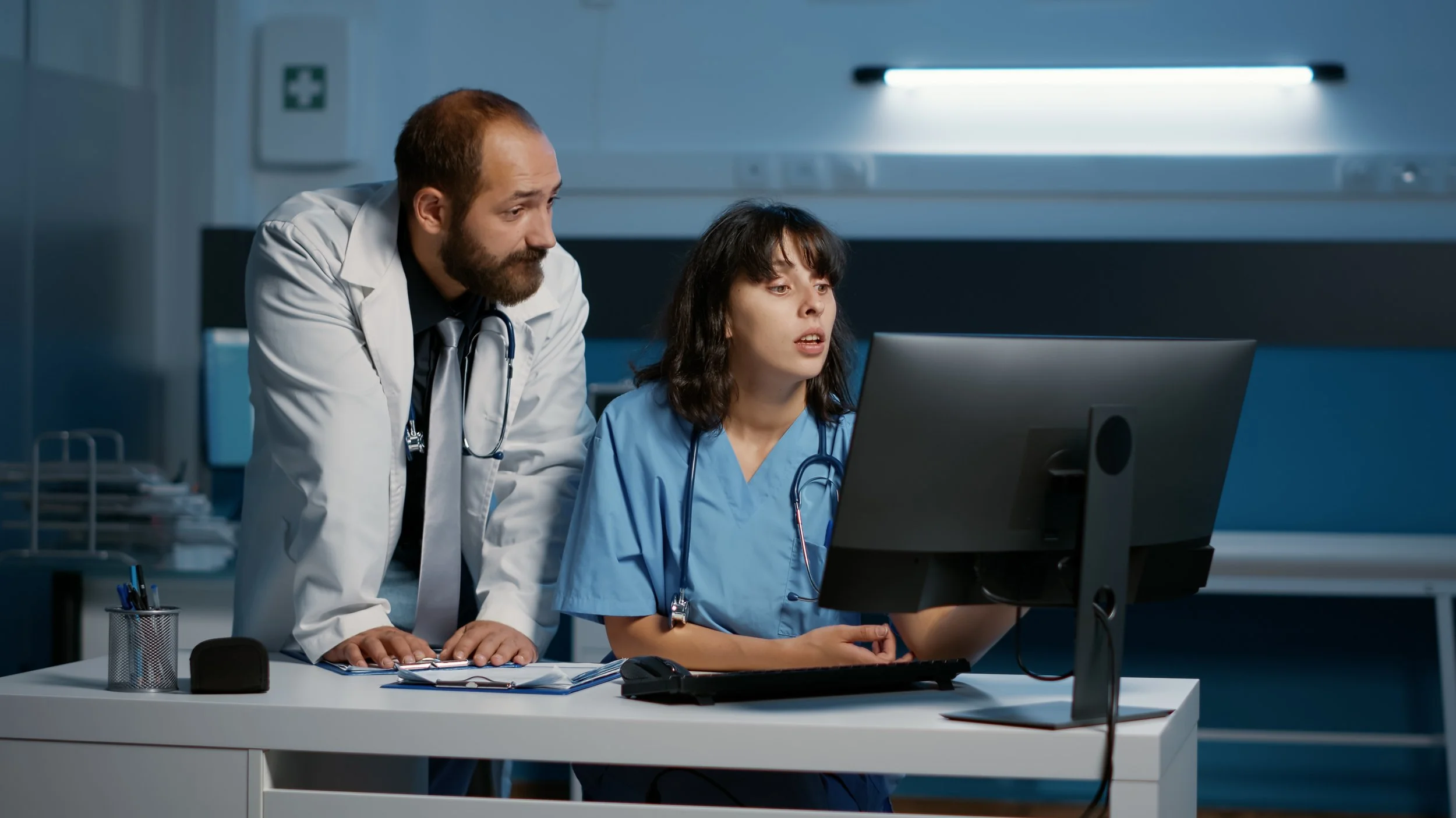 practitioner-and-nurse-checking-medical-report-on-2023-11-27-05-25-38-utc (1).jpg