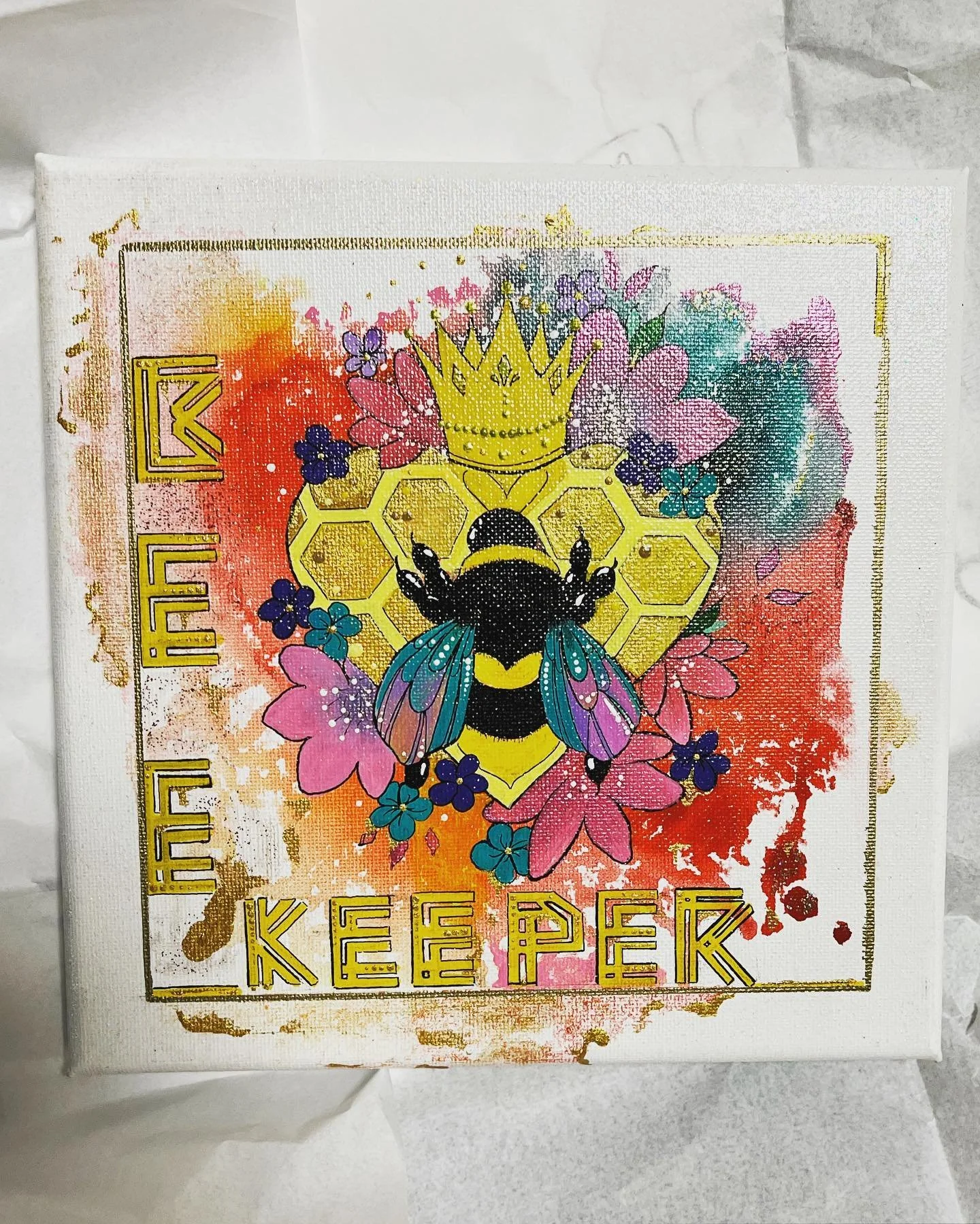 Colorful bee art with crown on honeycomb background, surrounded by flowers, text "Bee Keeper."handpainted by PleasantArt