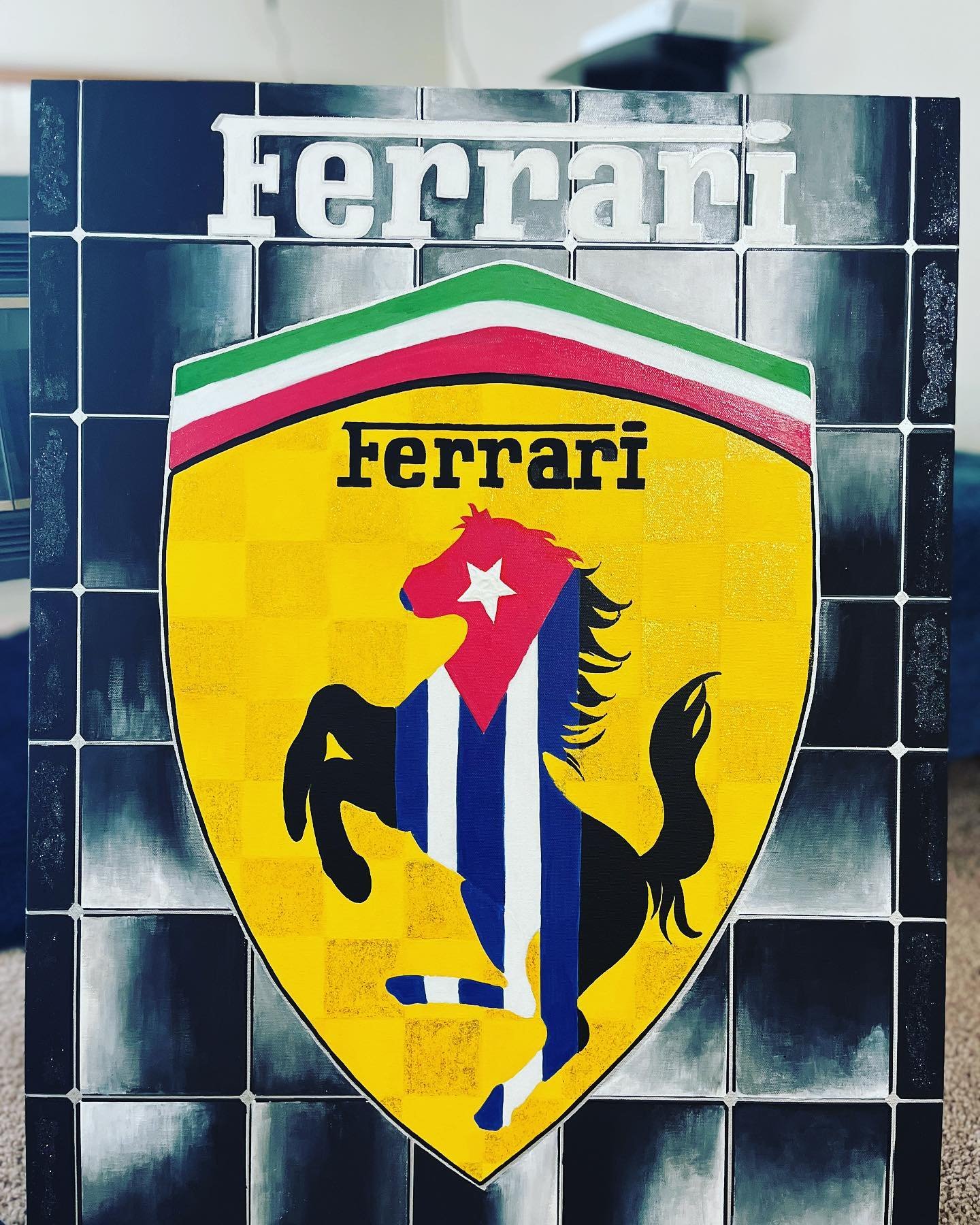 Artwork featuring a Ferrari emblem with a prancing horse in a Cuban flag pattern, set against a black and gray tile background, handpainted by PleasantArt