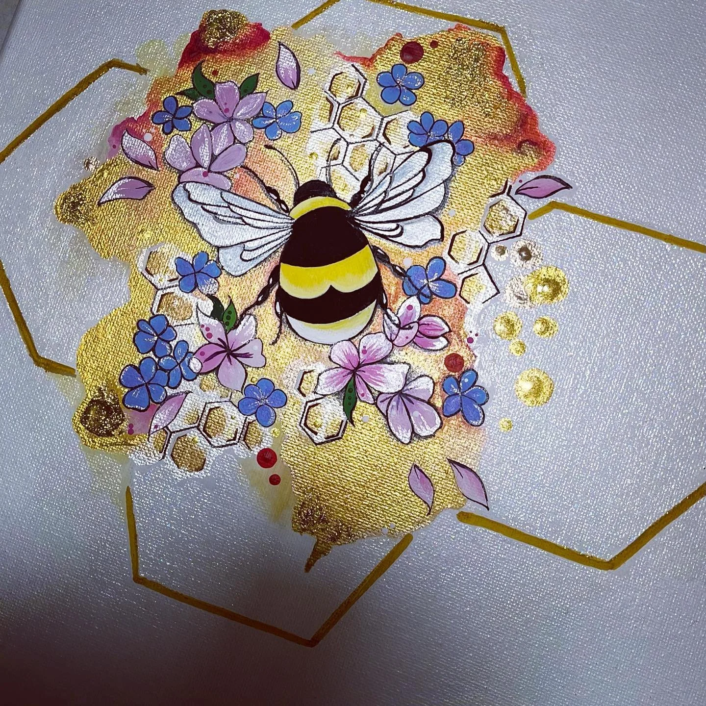 Artistic depiction of a bee surrounded by pink and blue flowers with honeycomb patterns and gold accents on a white background,handpainted by PleasantArt