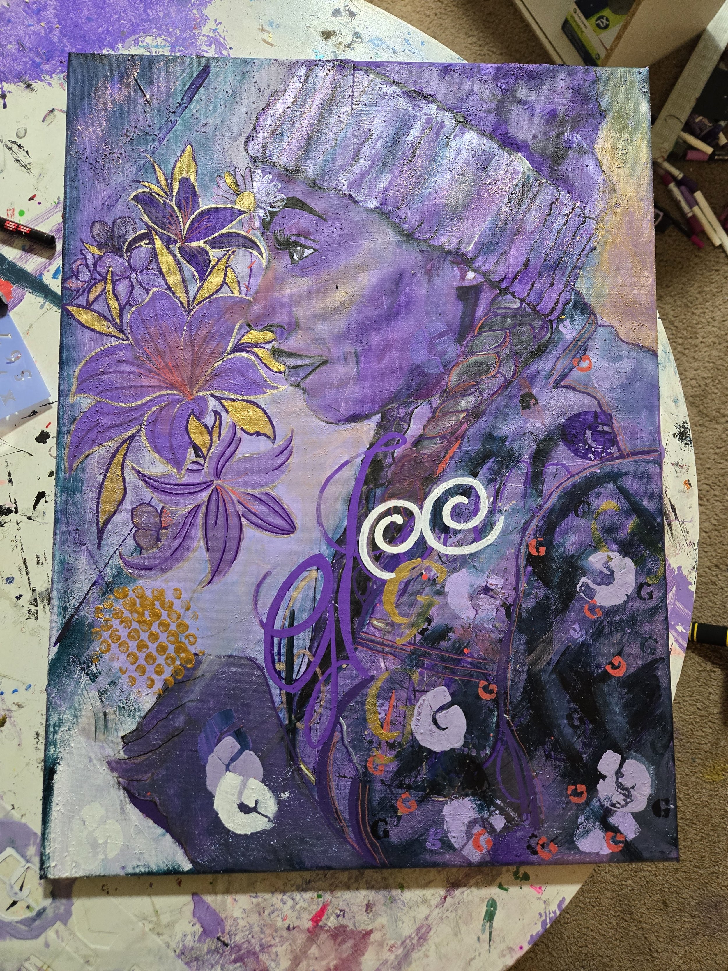 Purple-toned painting of a person smelling flowers, wearing a knitted beanie. The artwork features floral elements and abstract patterns, predominantly in purple, with yellow accents.