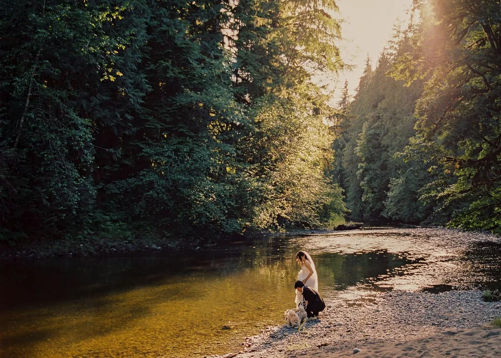 Couple by the Pilchuck River at Saiuen Gardens wedding venue