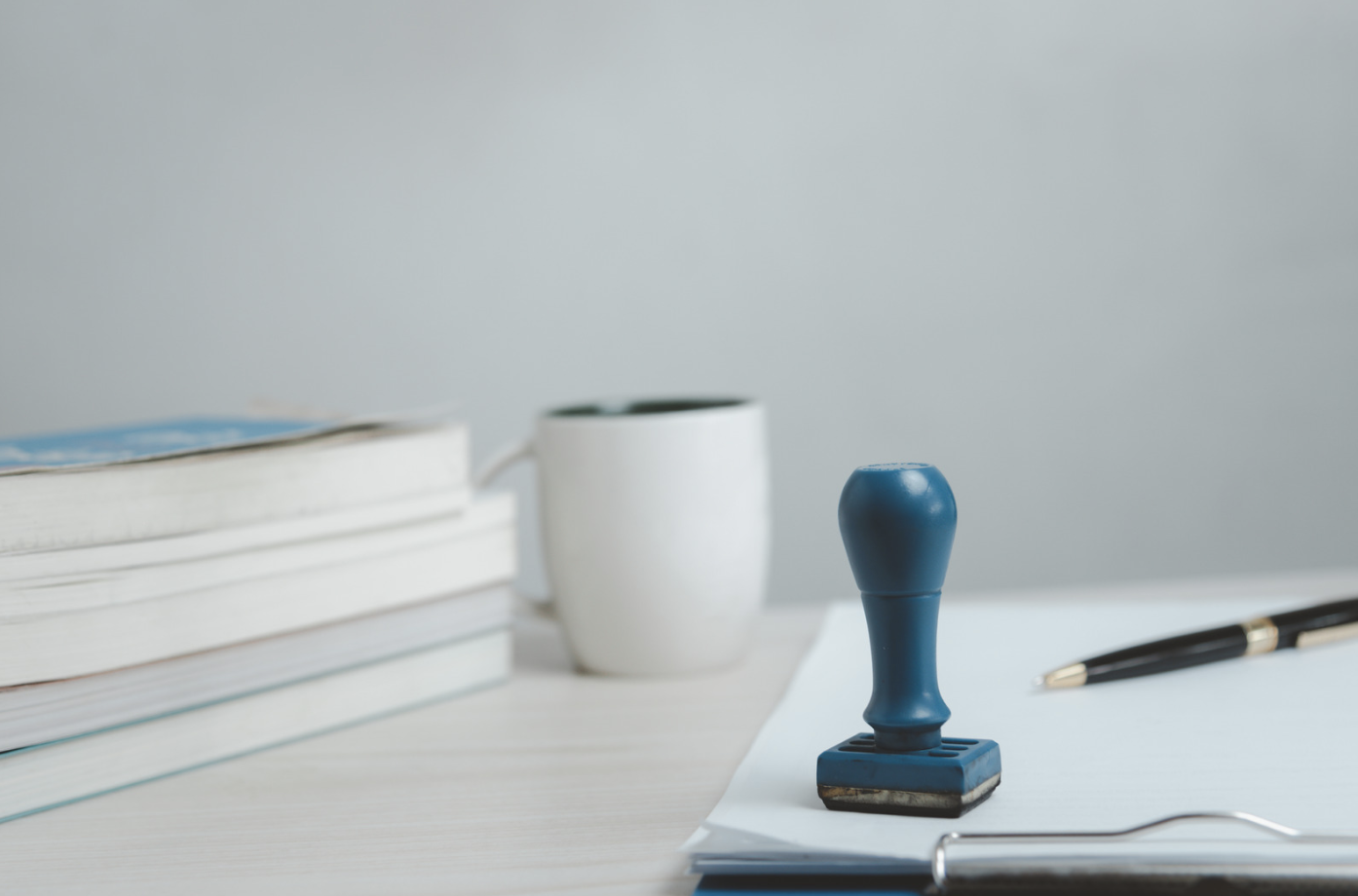 notary stamp and cup of coffee on a desk