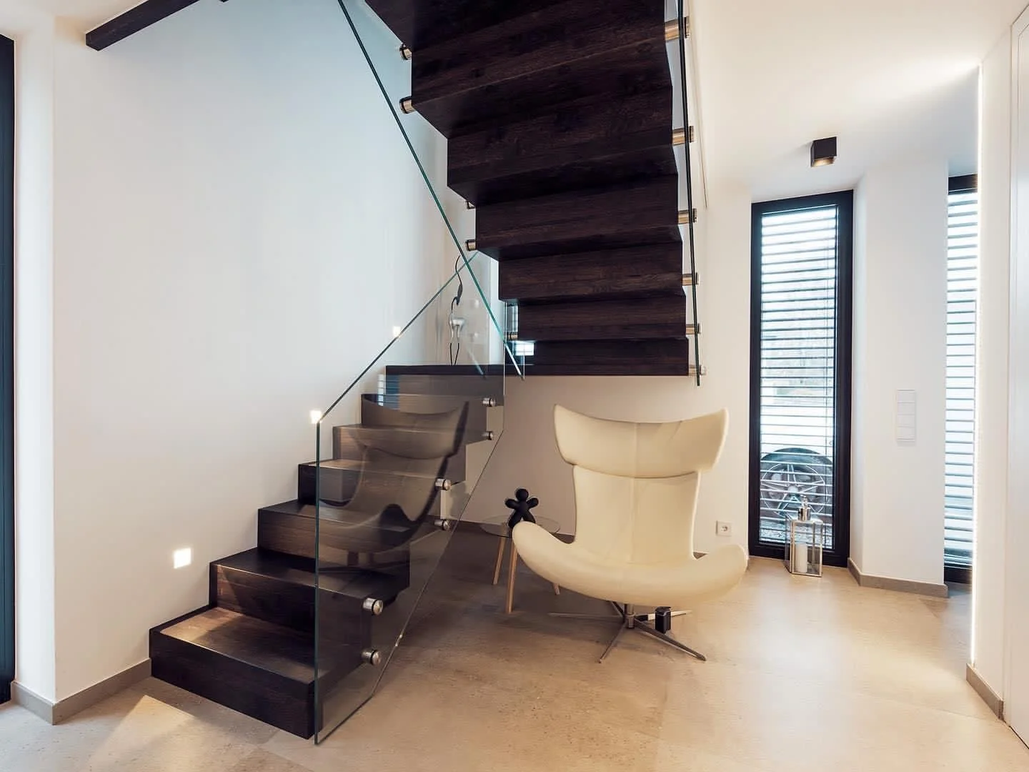 Dark brown high quality stairs with glass railing