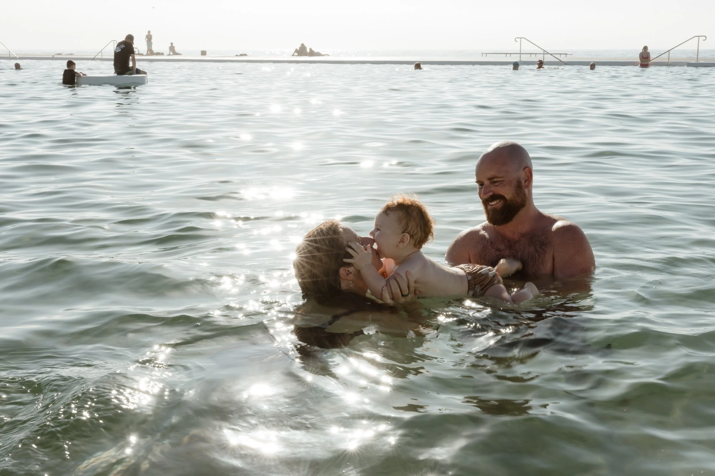 Natural and candid family moments at Newcastle Ocean Baths by Daina Marie Photography