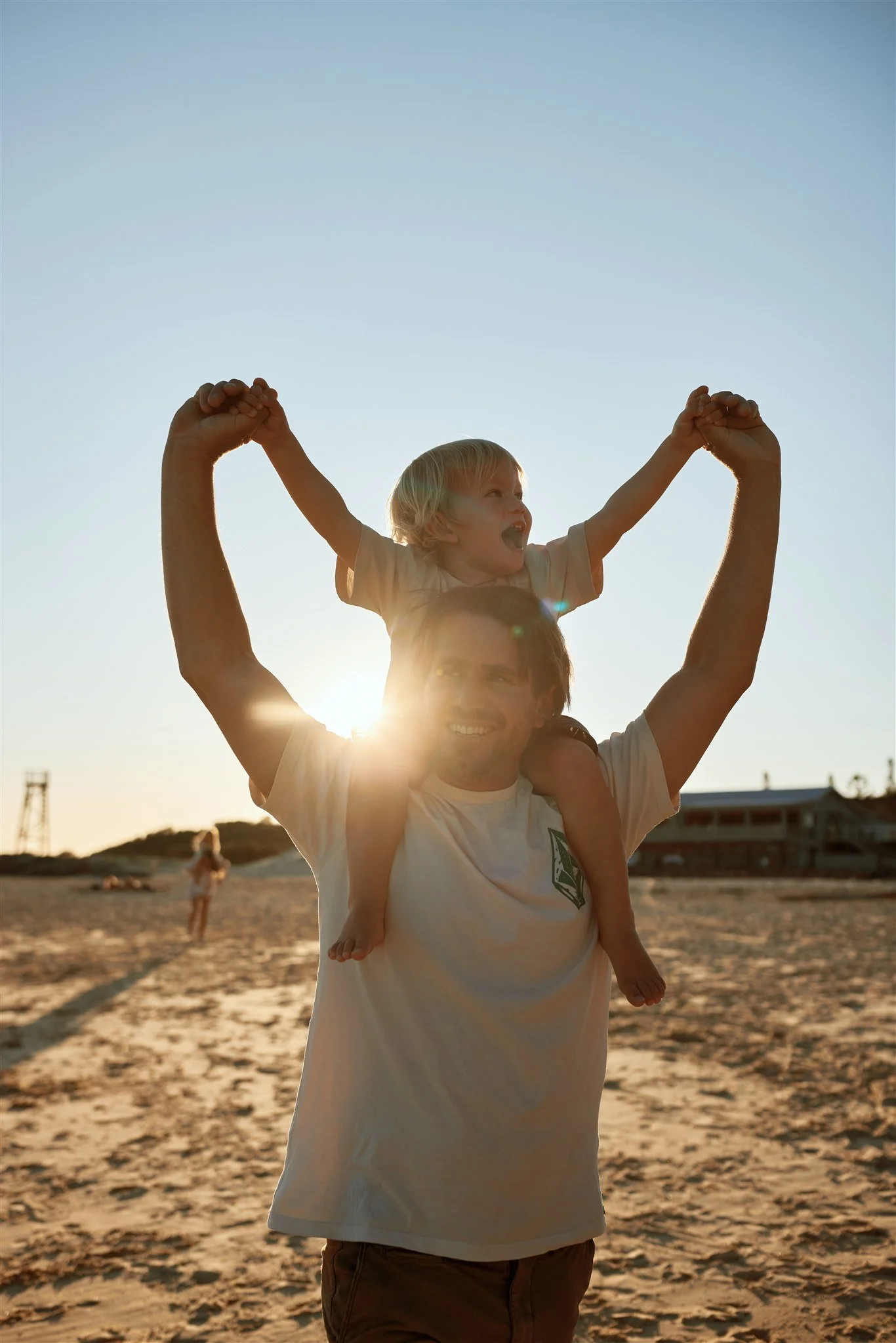 Heartfelt golden hour family moments at Redhead Beach Newcastle by Daina Marie Photography