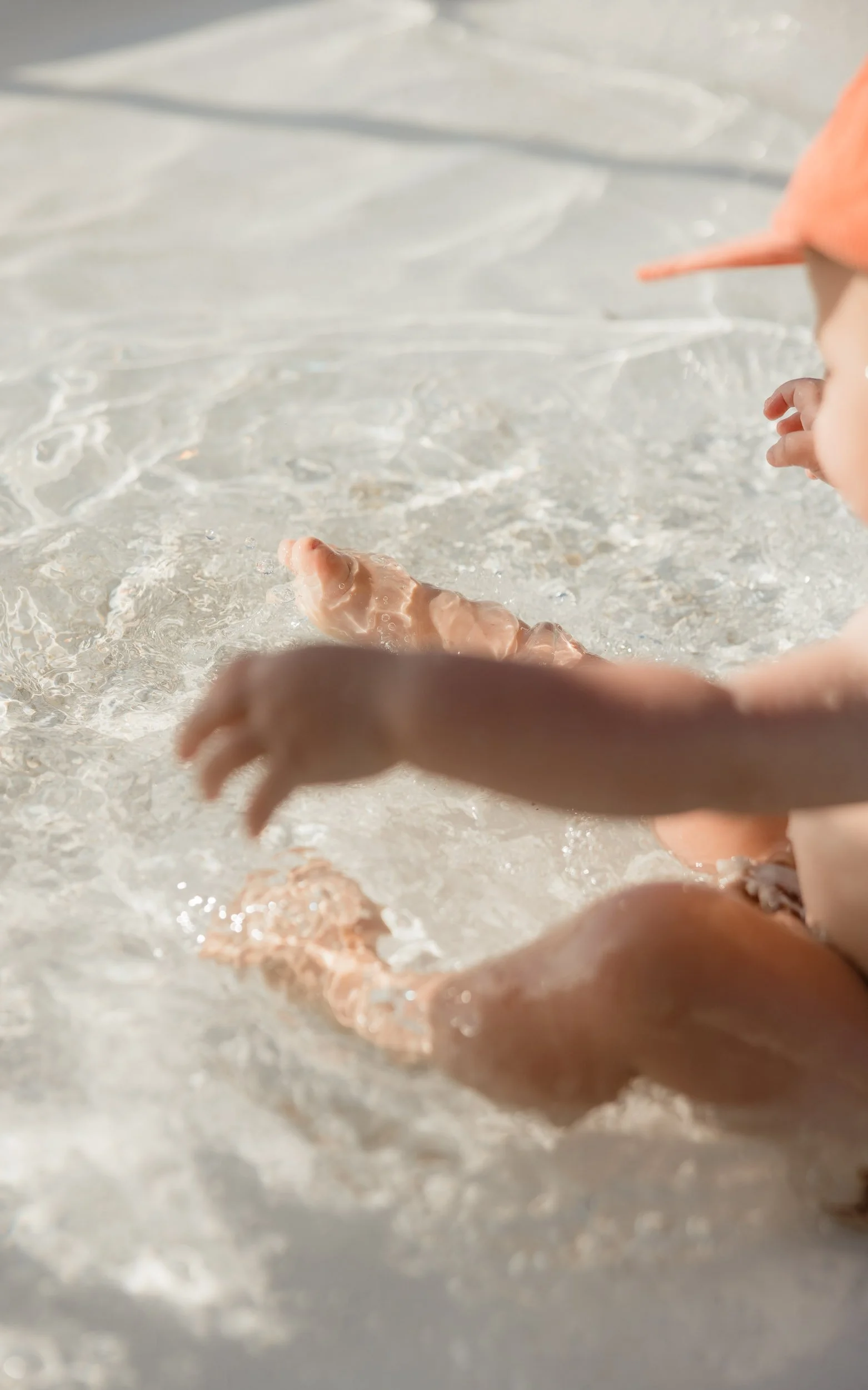 Young family enjoying summer at Newcastle Ocean Baths captured by Newcastle family photographer