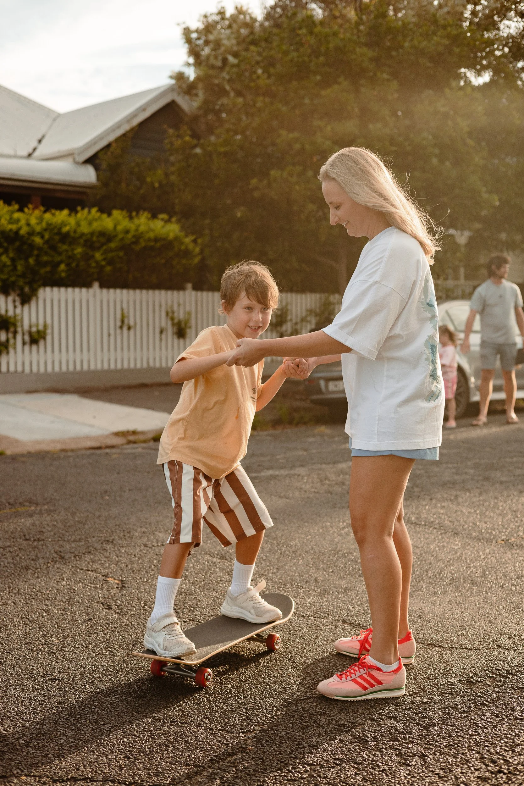 Family skateboarding through Merewether Newcastle documentary session by Daina Marie Photography