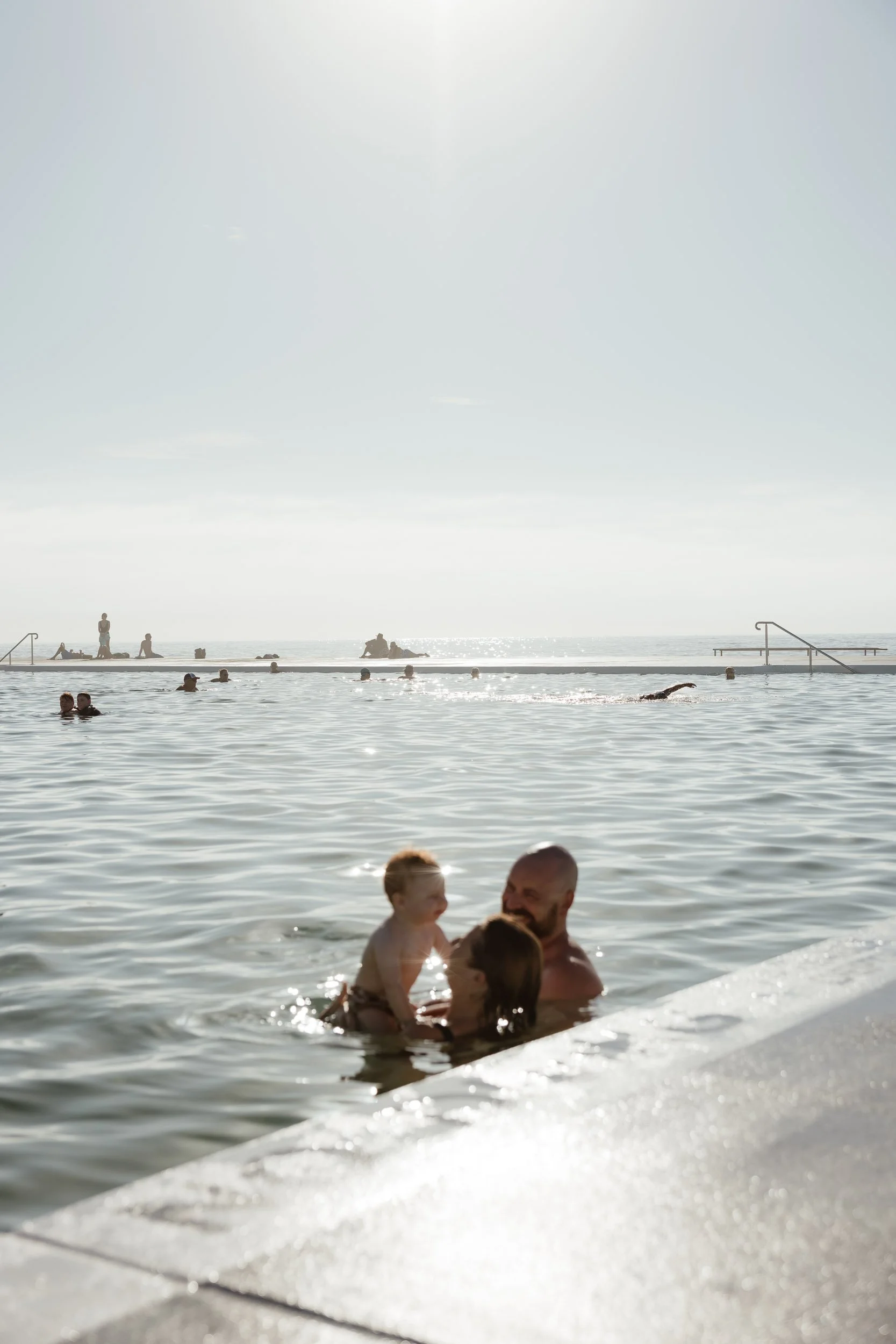 Baby's first summer at Newcastle Ocean Baths documentary family session Newcastle NSW