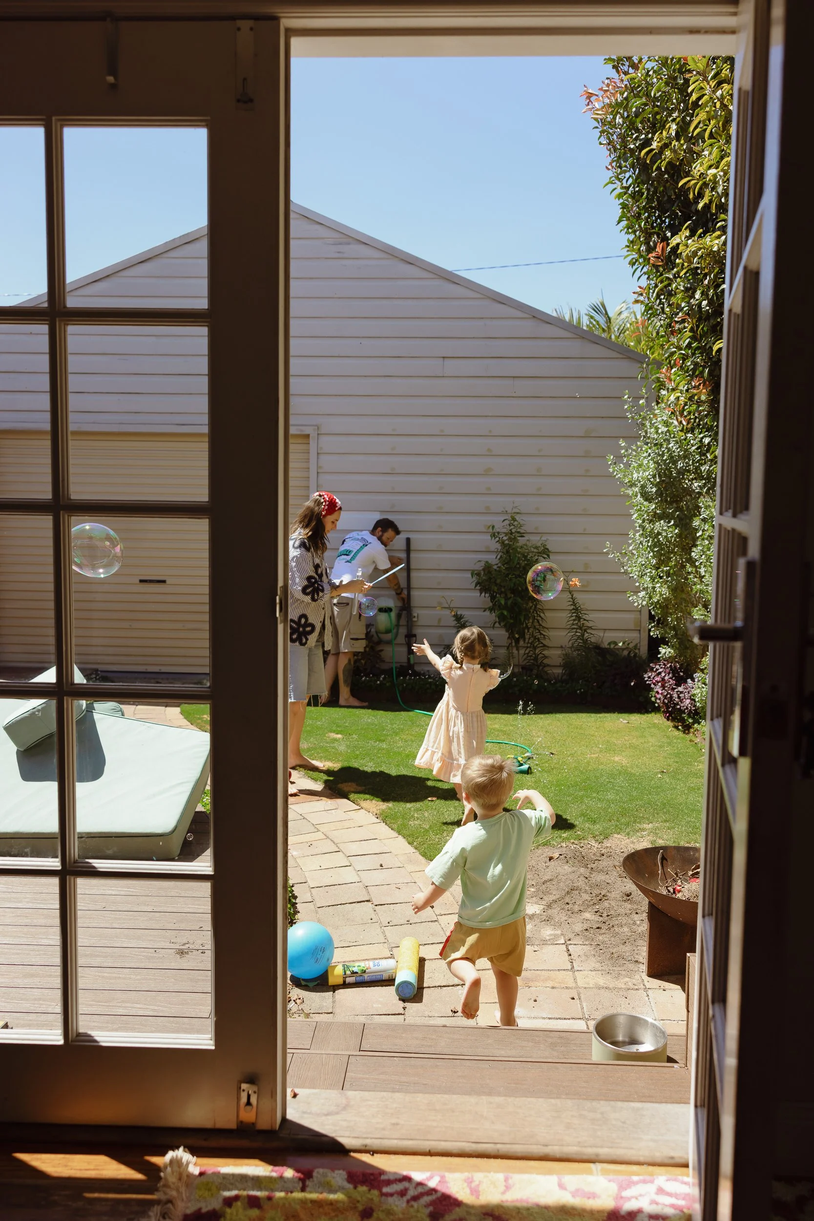 Young family of four captured at home in Newcastle by Daina Marie Photography