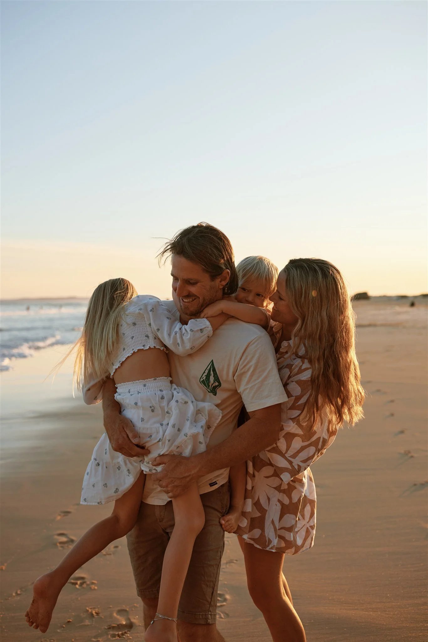 Family of four at Redhead Beach Newcastle photographed by Daina Marie Photography