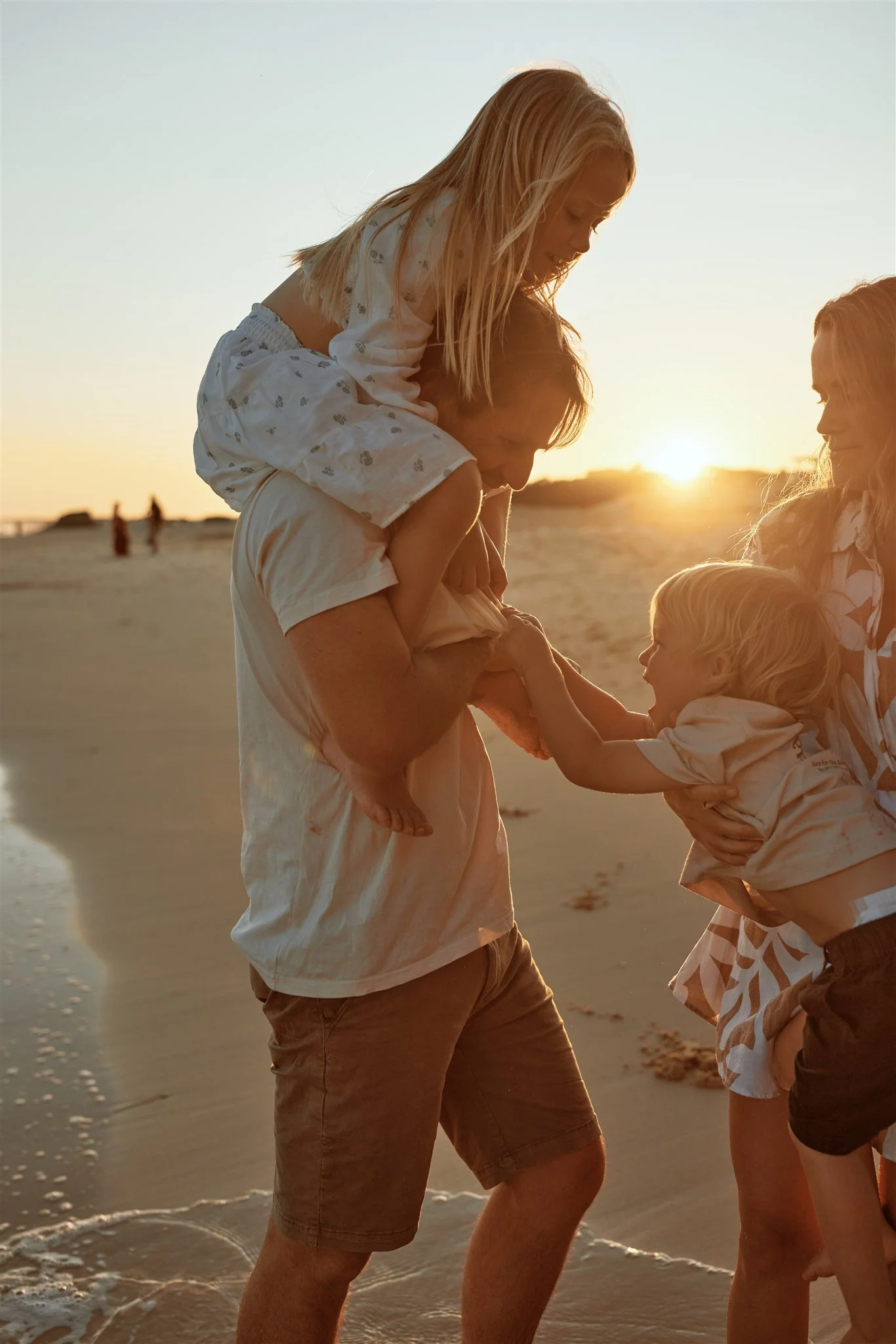 Toddler and primary school aged kids playing at Redhead Beach captured by Newcastle family photographer