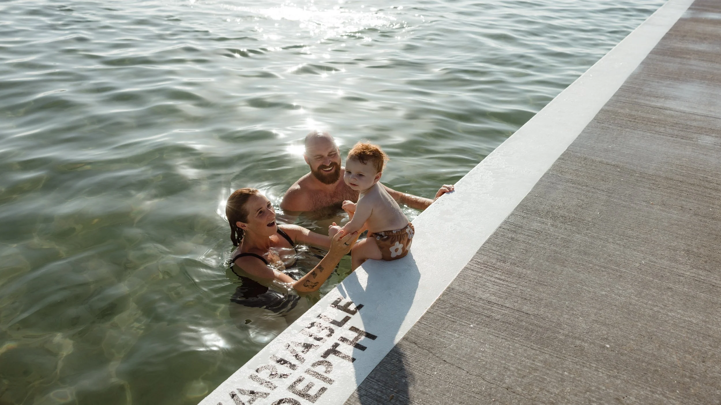 Baby's first summer at Newcastle Ocean Baths documentary family session Newcastle NSW