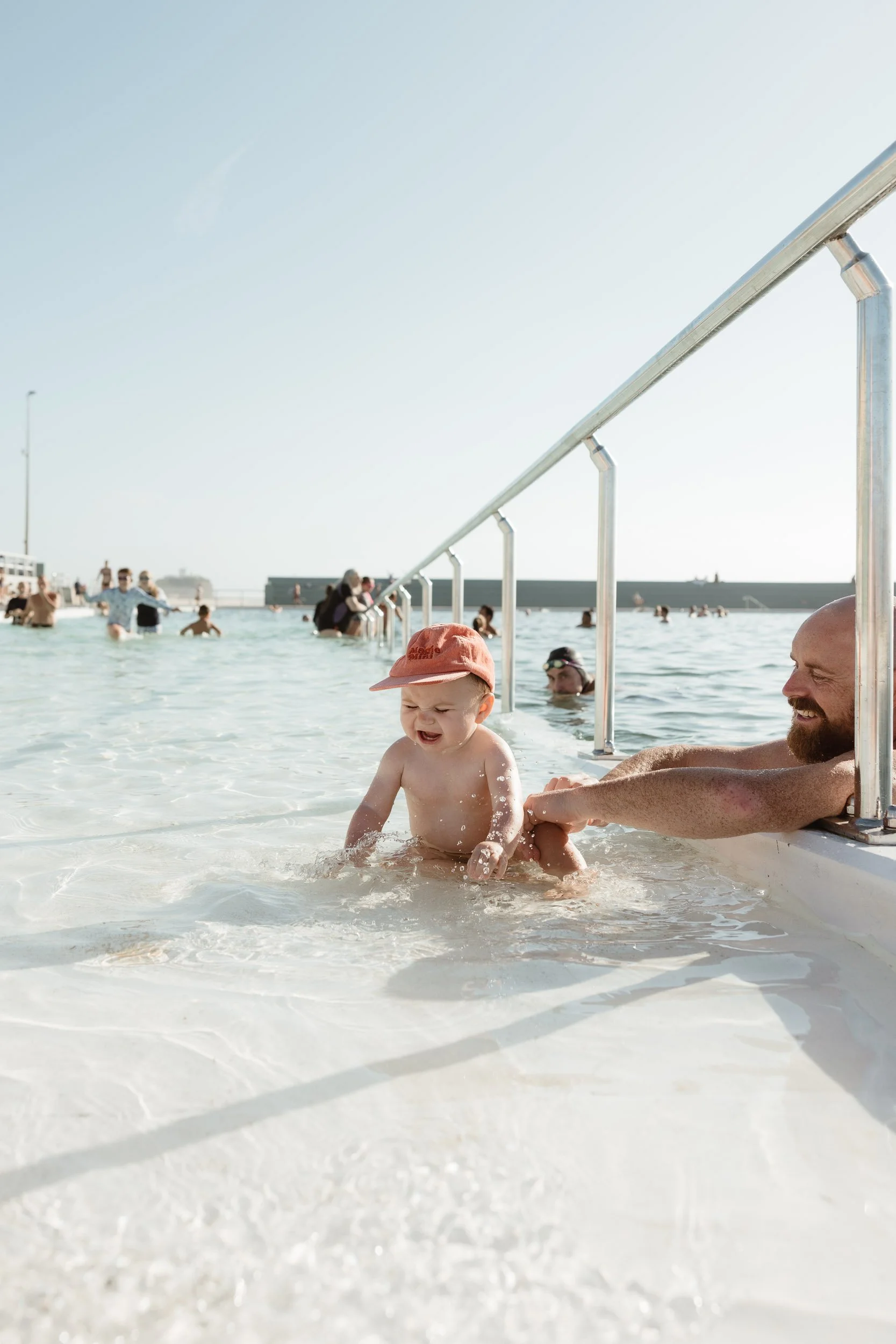 Baby's first summer at Newcastle Ocean Baths documentary family session Newcastle NSW