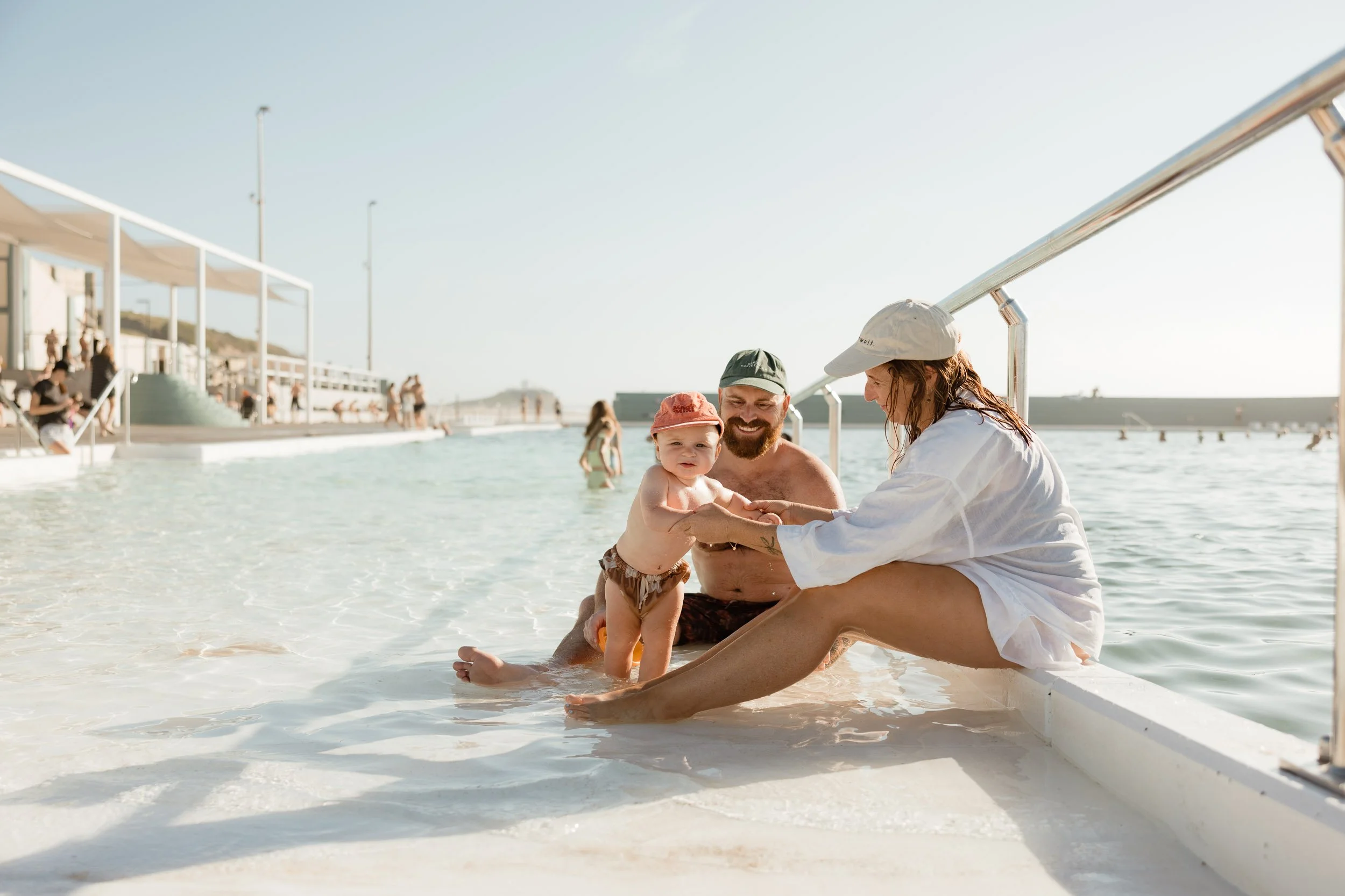 Natural and candid family moments at Newcastle Ocean Baths by Daina Marie Photography