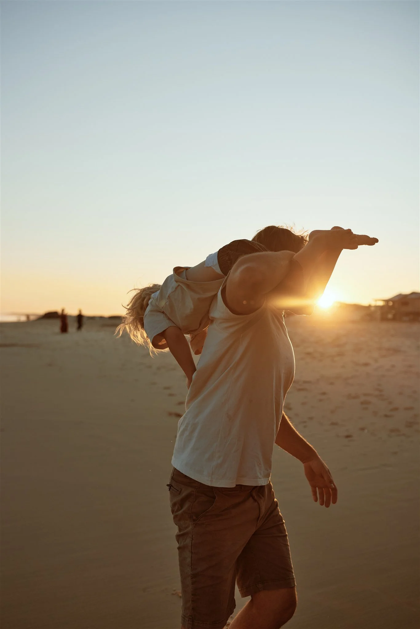 Heartfelt golden hour family moments at Redhead Beach Newcastle by Daina Marie Photography