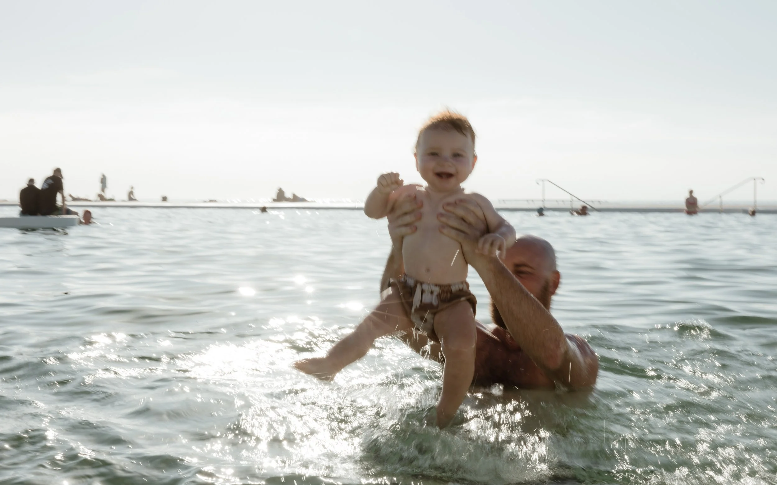 Candid family photography at Newcastle Ocean Baths by Daina Marie Photography
