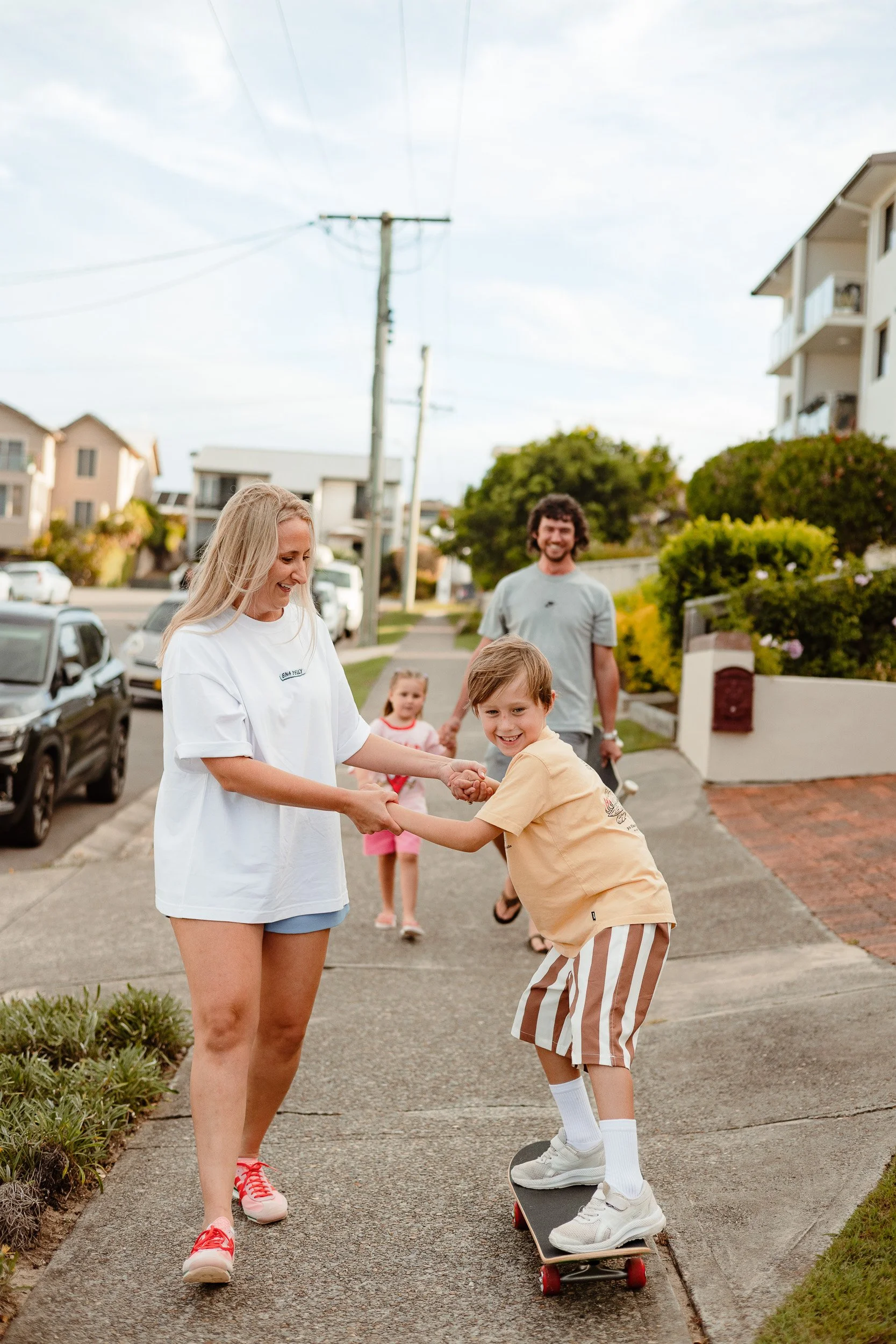 Family skateboarding through Merewether Newcastle documentary session by Daina Marie Photography