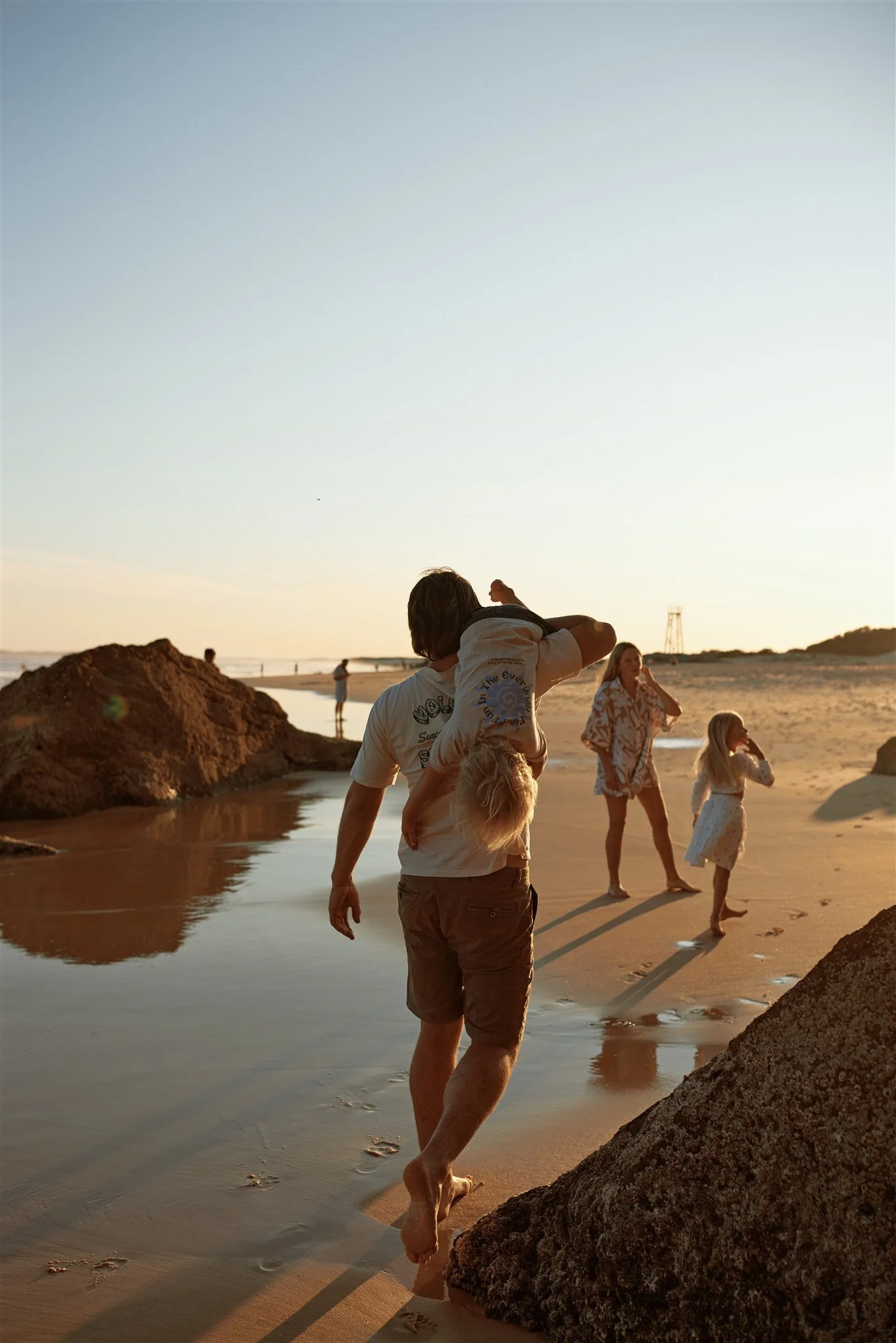 Toddler and primary school aged kids playing at Redhead Beach captured by Newcastle family photographer