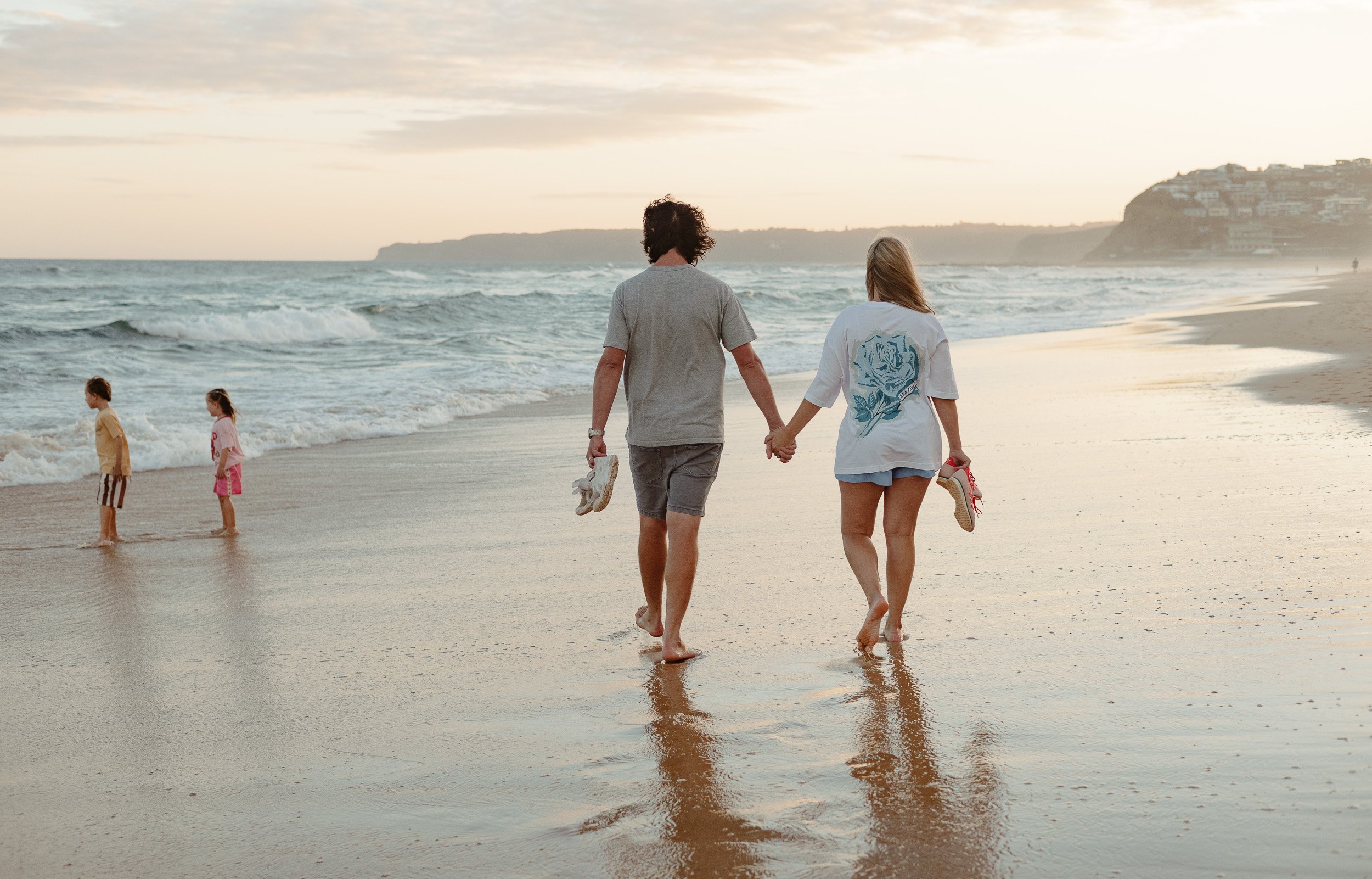 Kids jumping into the ocean at Merewether Beach captured by Newcastle family photographer