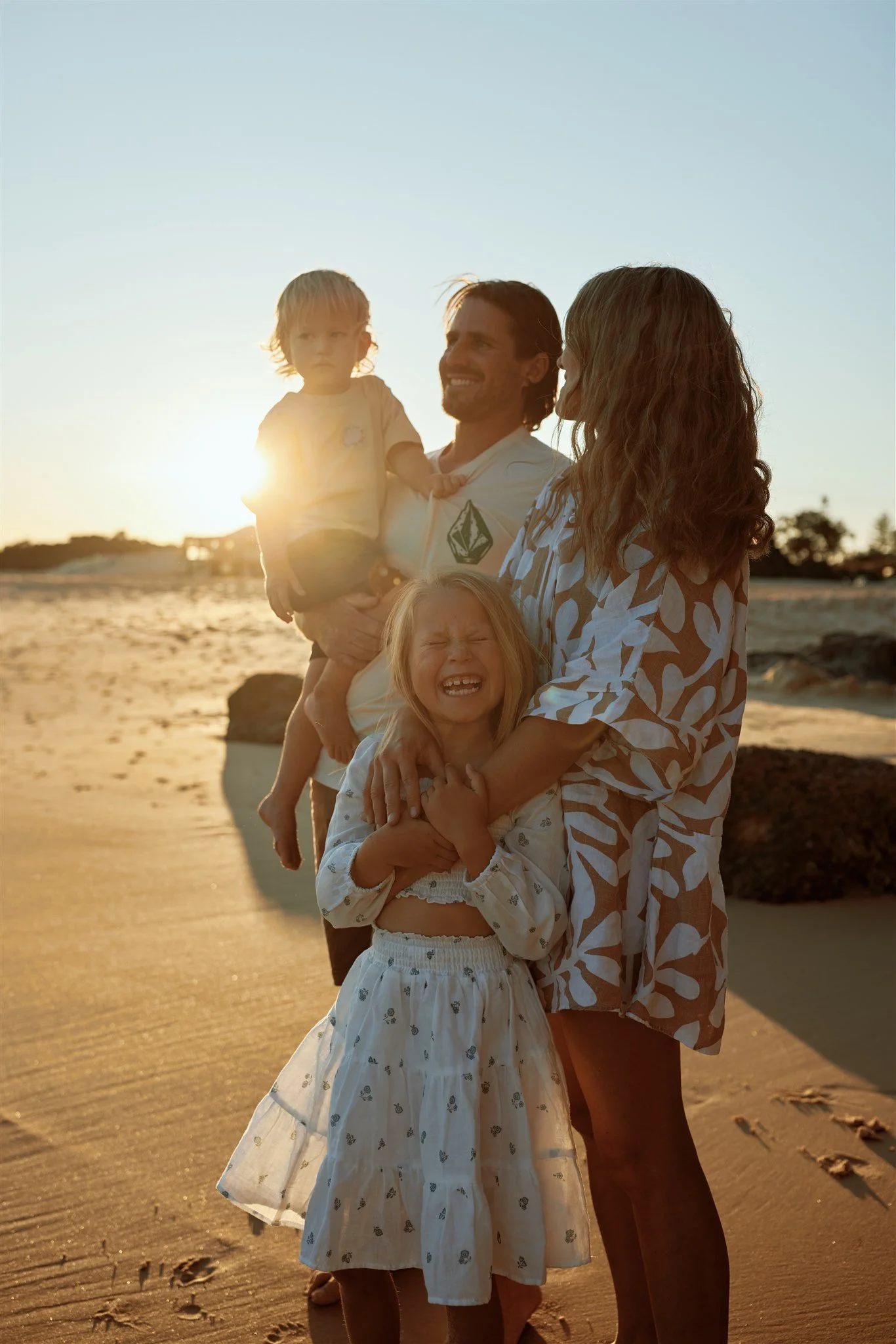 Newcastle documentary family photographer captures golden hour family session at Redhead Beach