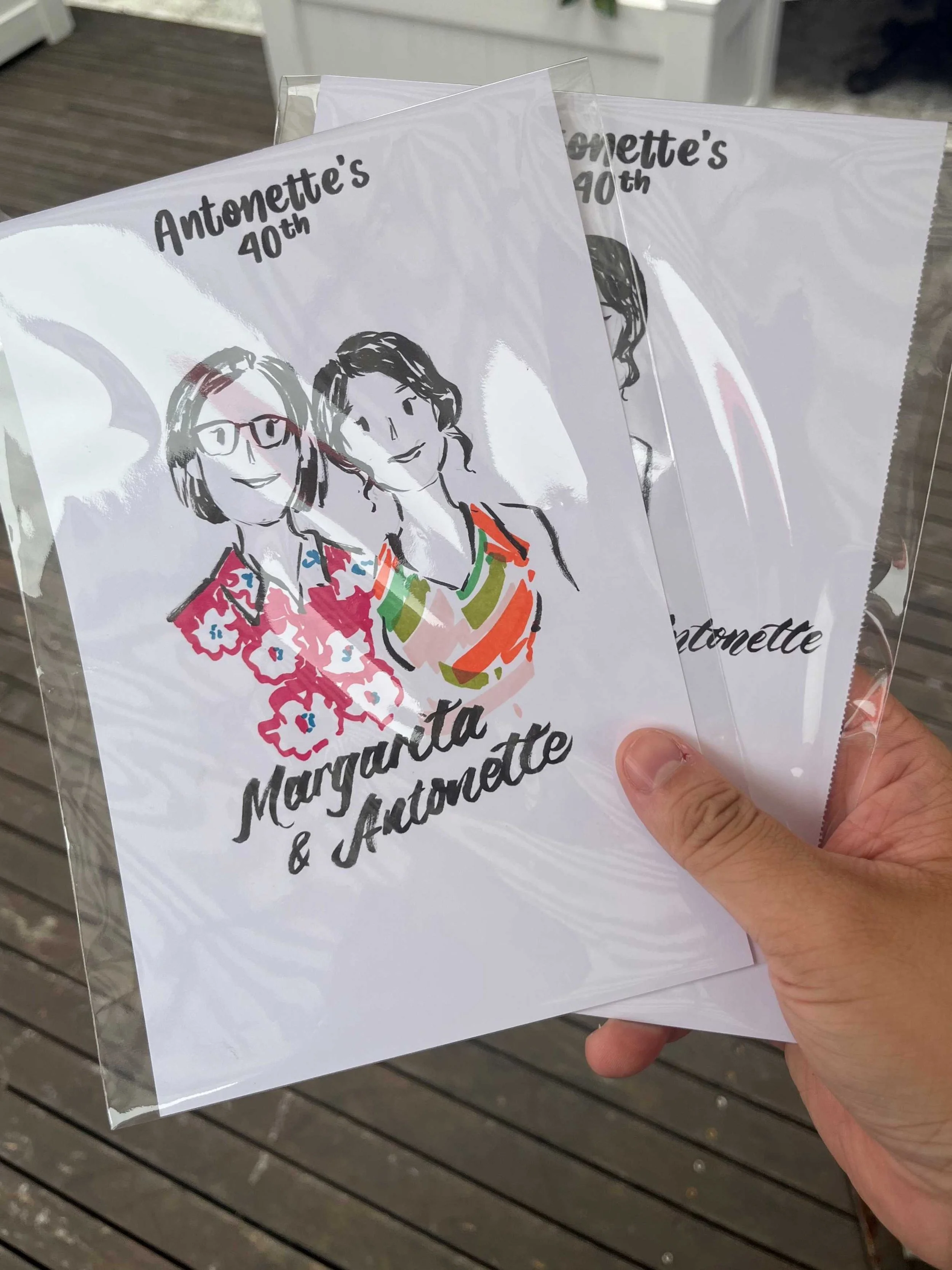 sydney-live-illustration-artist-holding-drawings