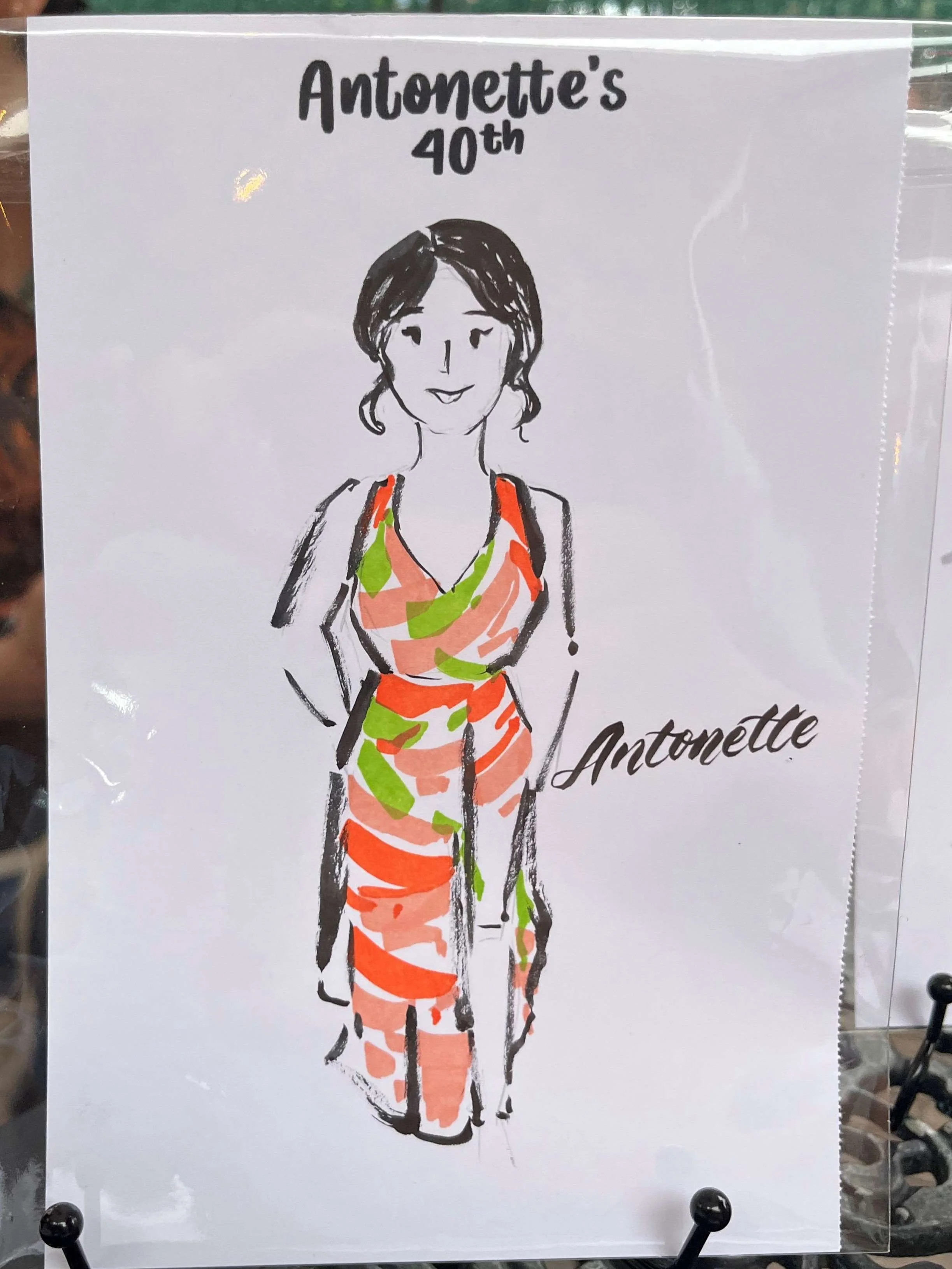 sydney-live-illustration-artist-holding-drawings
