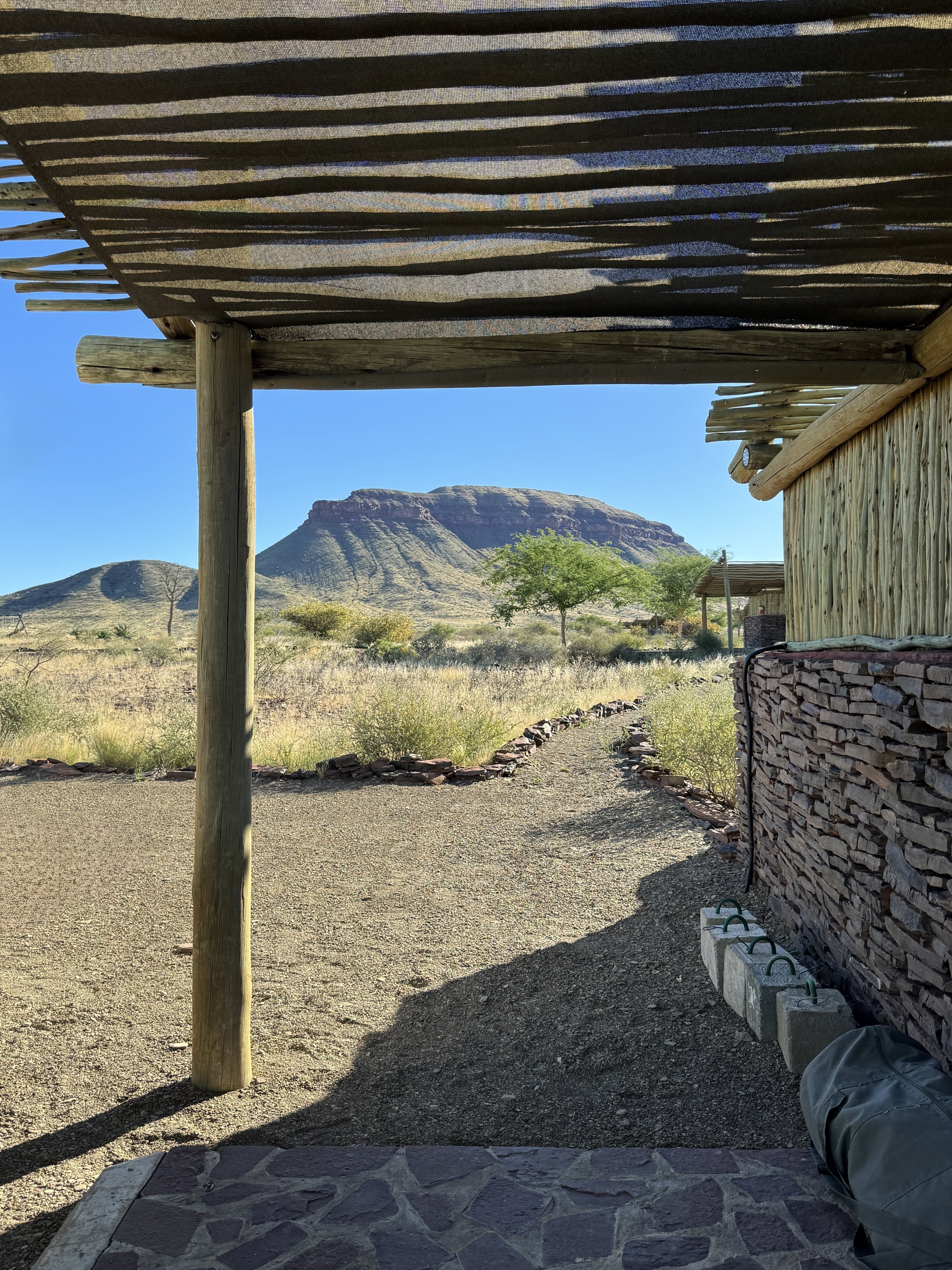 views from a campsite at Mount d’Urban in Namibia with rocky peaks and open plains