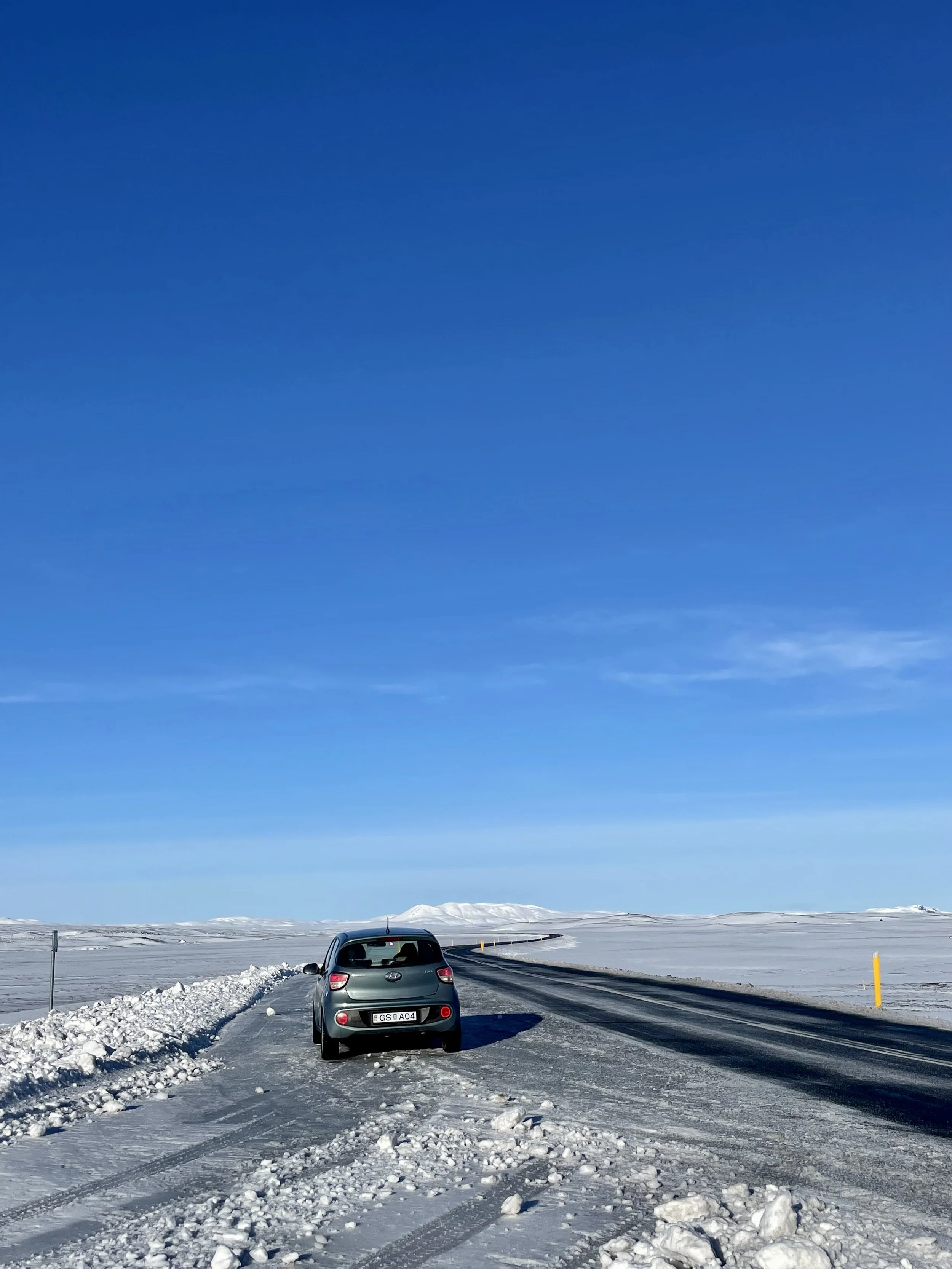 Car parked beside Iceland’s Ring Road during a 2-week adventure exploring the island’s highlights.