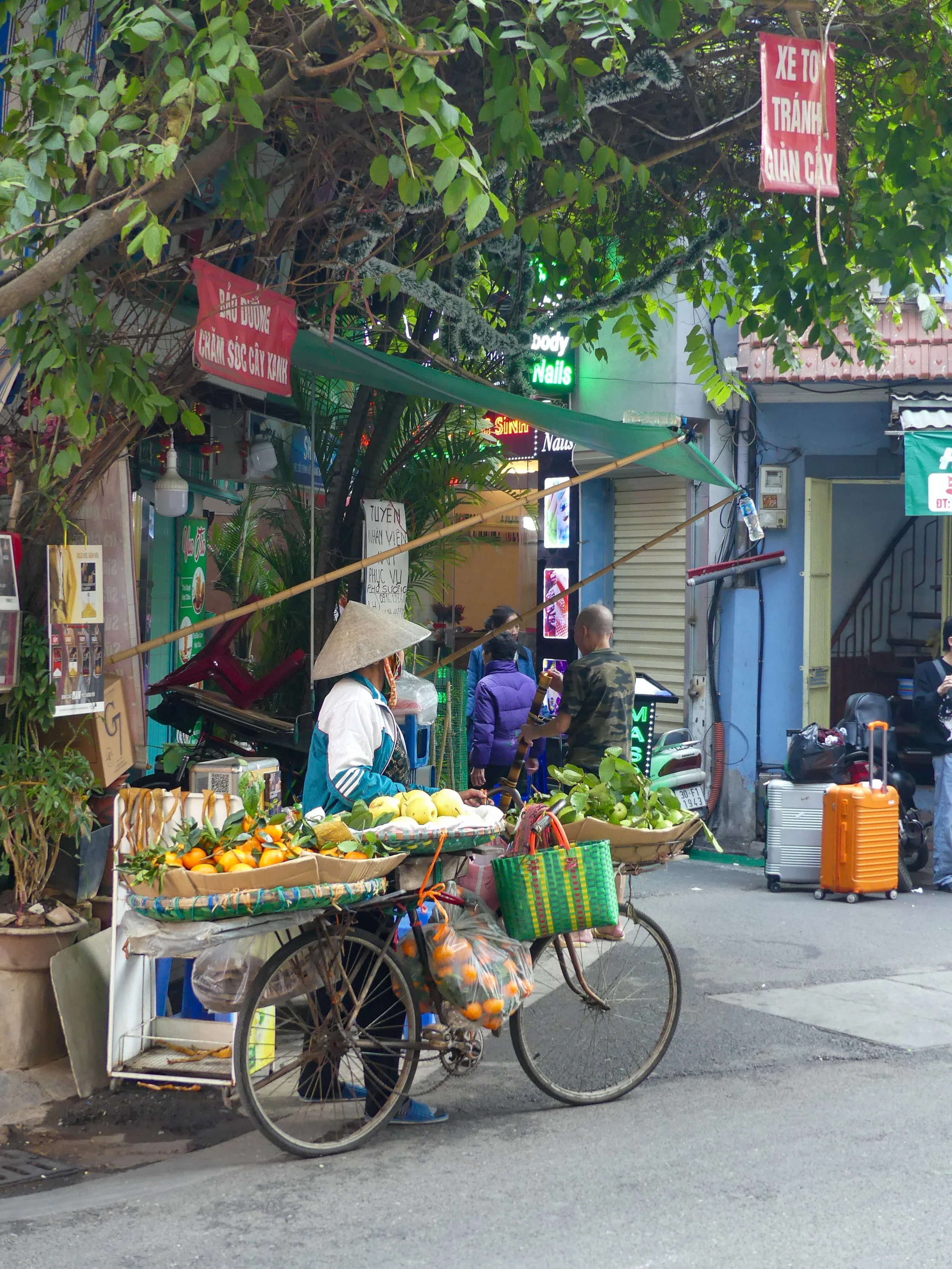 Street vendor with a selling fruits in Vietnam. The best Vietnam travel guide. Where to go in Vietnam. When to visit Vietnam. Vietnam travel tips. Vietnam itinerary. Vietnam travel guide