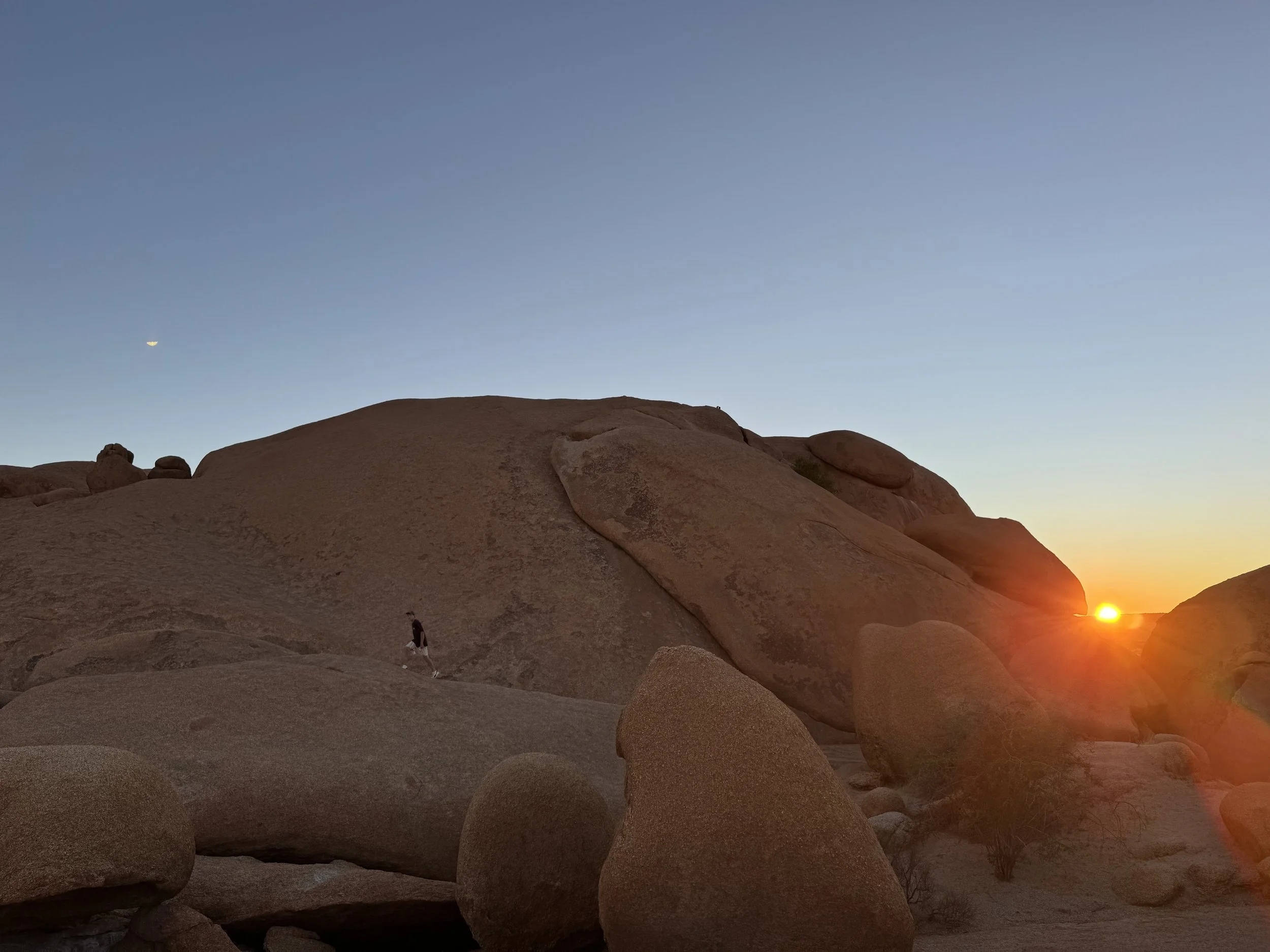 Climbing and exploring Spitzkoppe Namibia granite mountains in the desert at sunrise