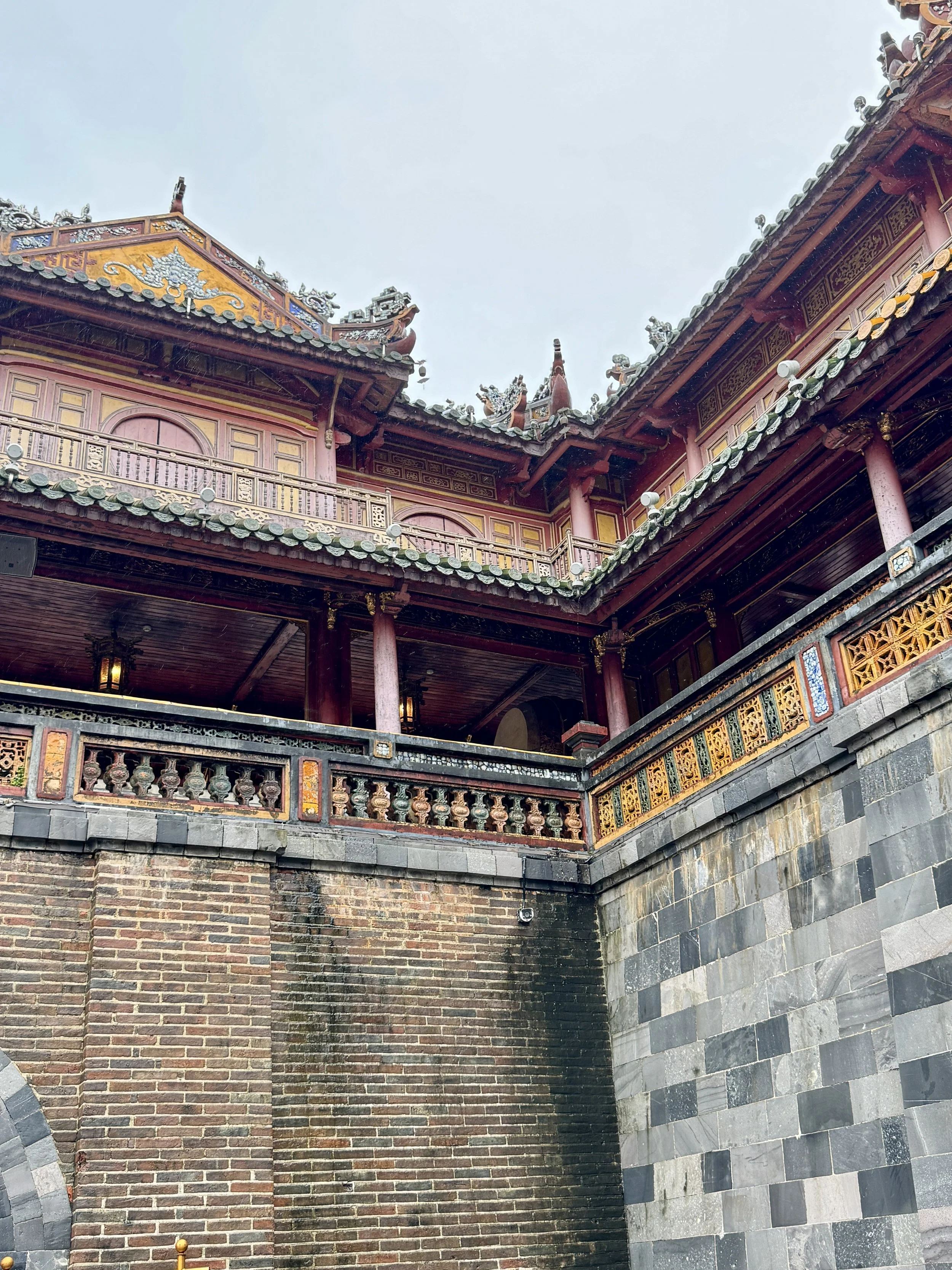 Traditional Asian architecture with ornate roof and intricate carvings.