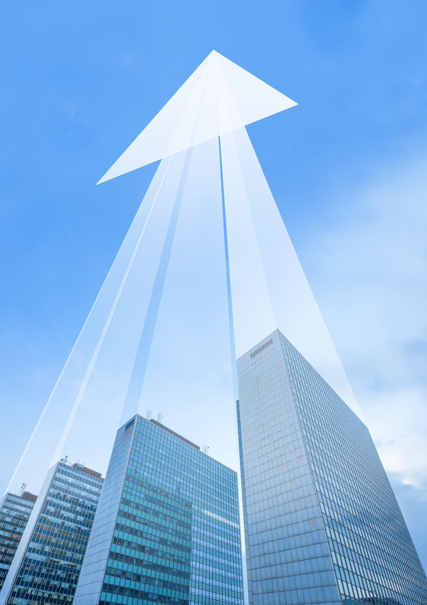 Tall glass skyscrapers in a city under a partly cloudy sky, viewed from the ground looking up.
