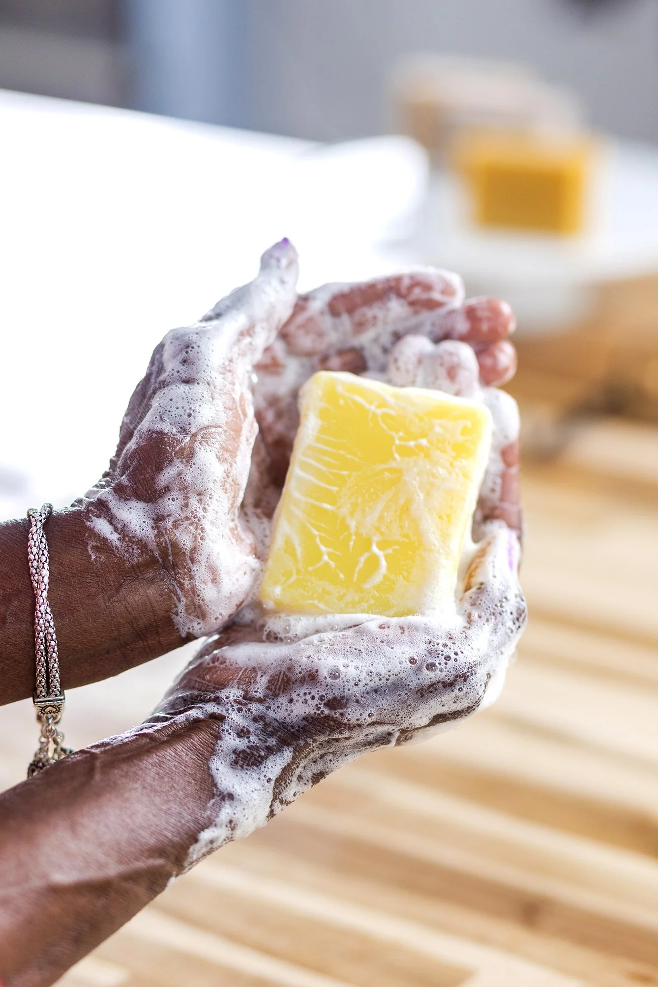Hands holding lathered up soap
