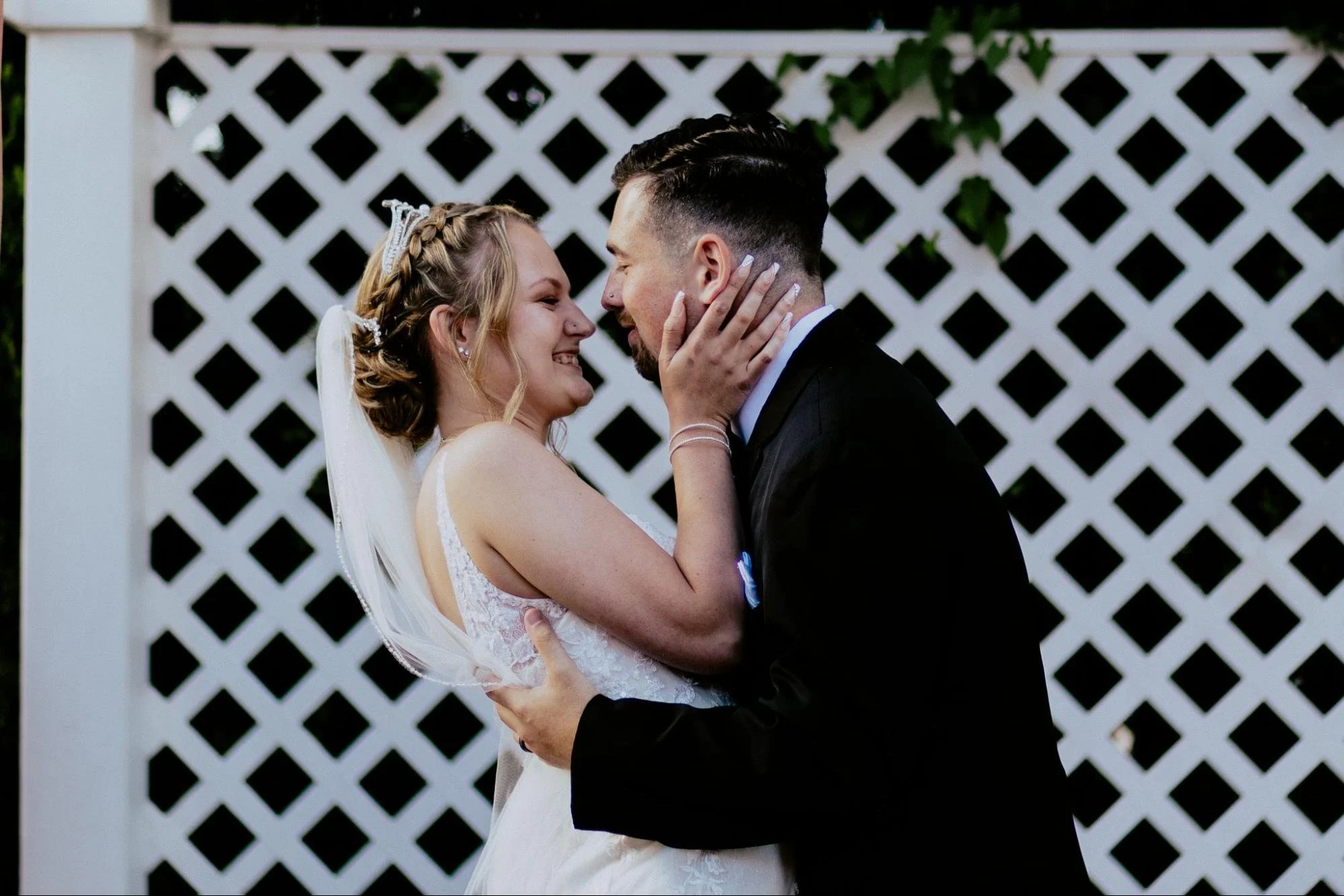 Detroit wedding photographer capturing a joyful bride and groom sharing an intimate moment during their wedding day.
