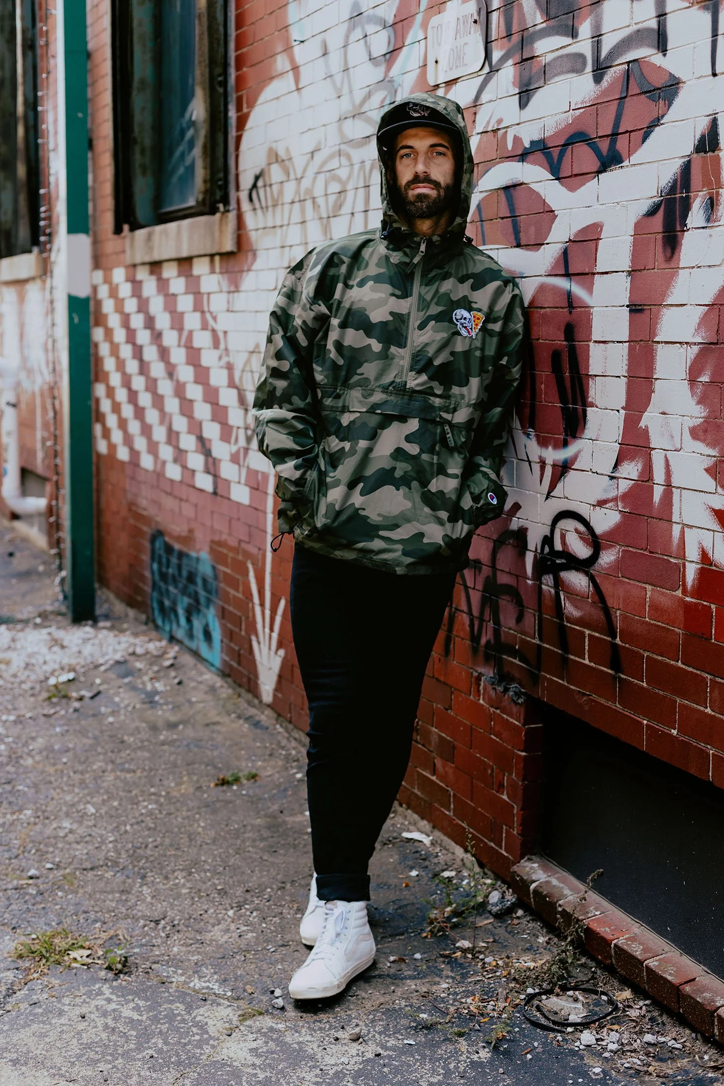 Detroit apparel photography for Skeleton Pizza Supply Co windbreaker and hat designs