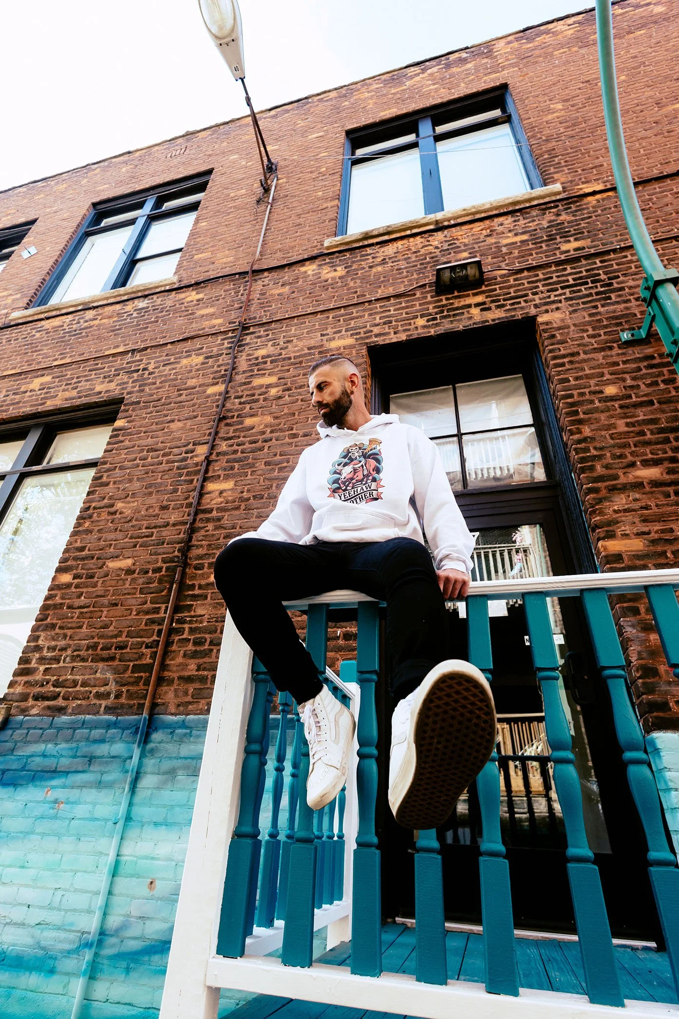 Skeleton Pizza Supply Co branded hoodie photographed in Pontiac Michigan