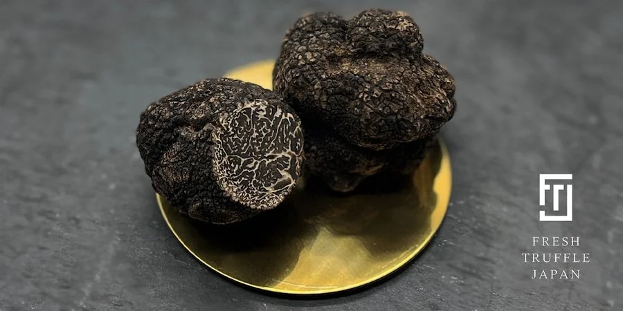 black truffles on gold plate