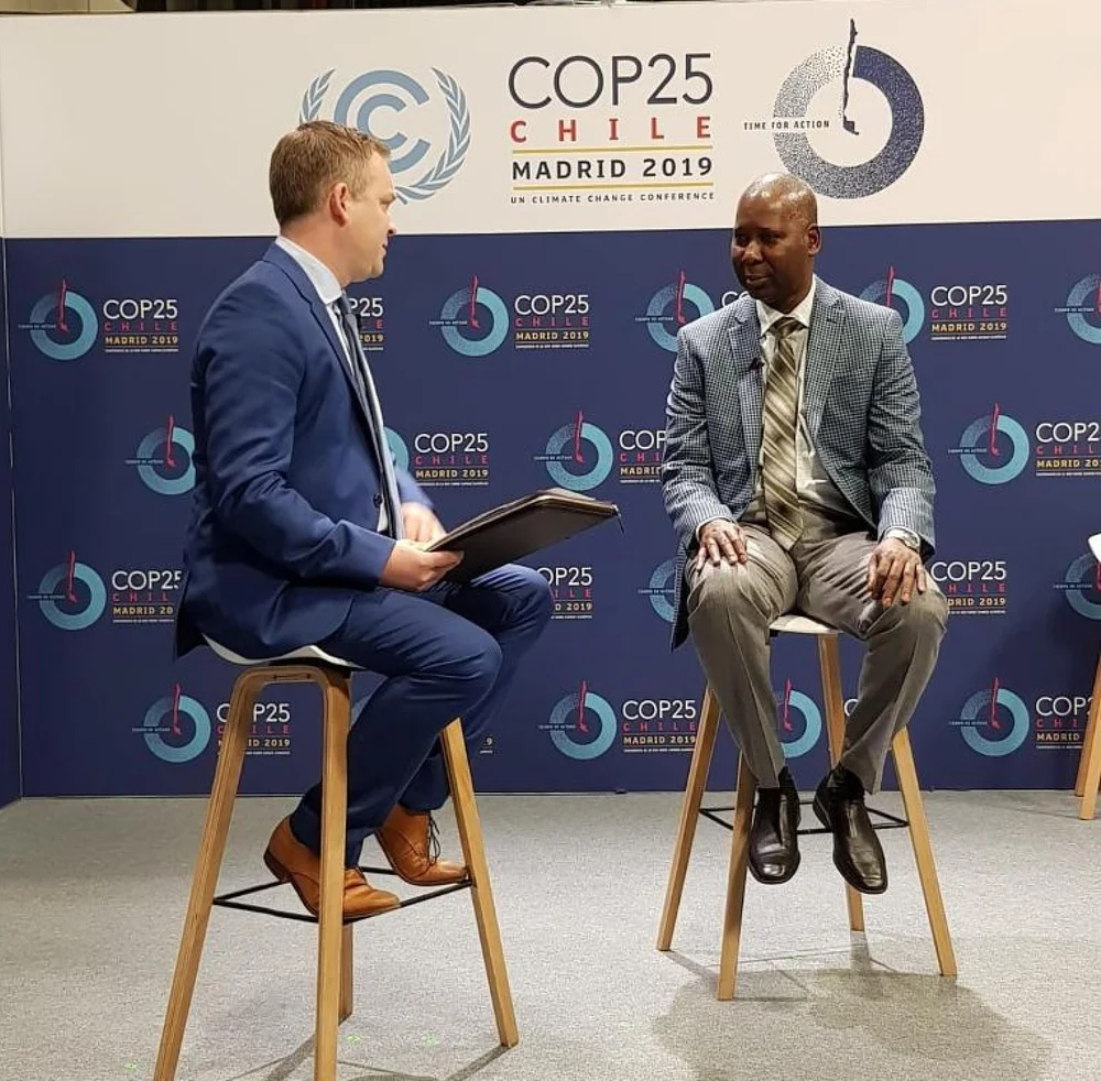 Brent Kerrigan being interviewed during international climate negotiations