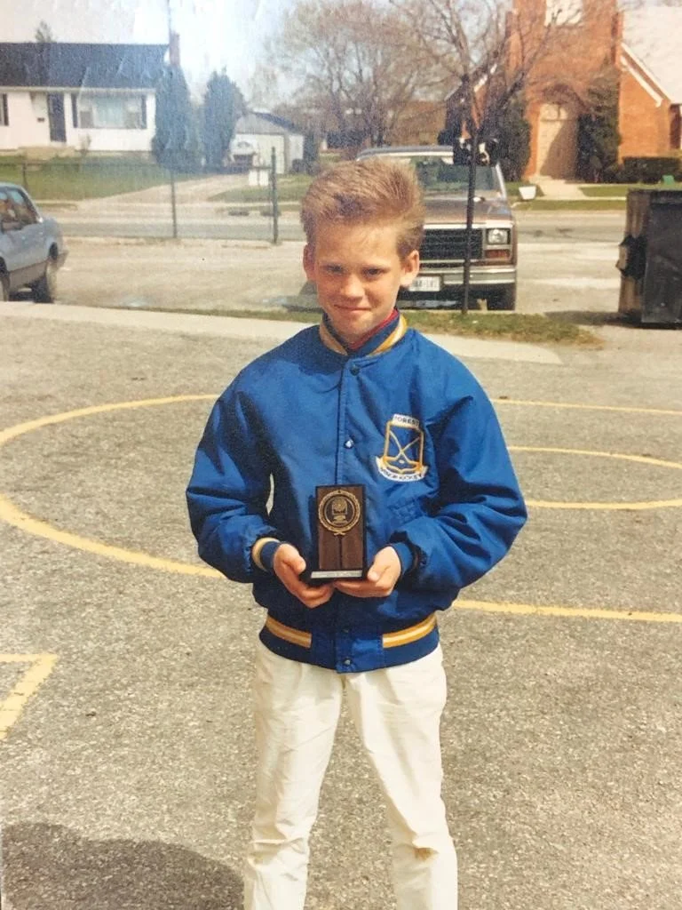 Brent Kerrigan, holding speechwriting trophy in Grade 4