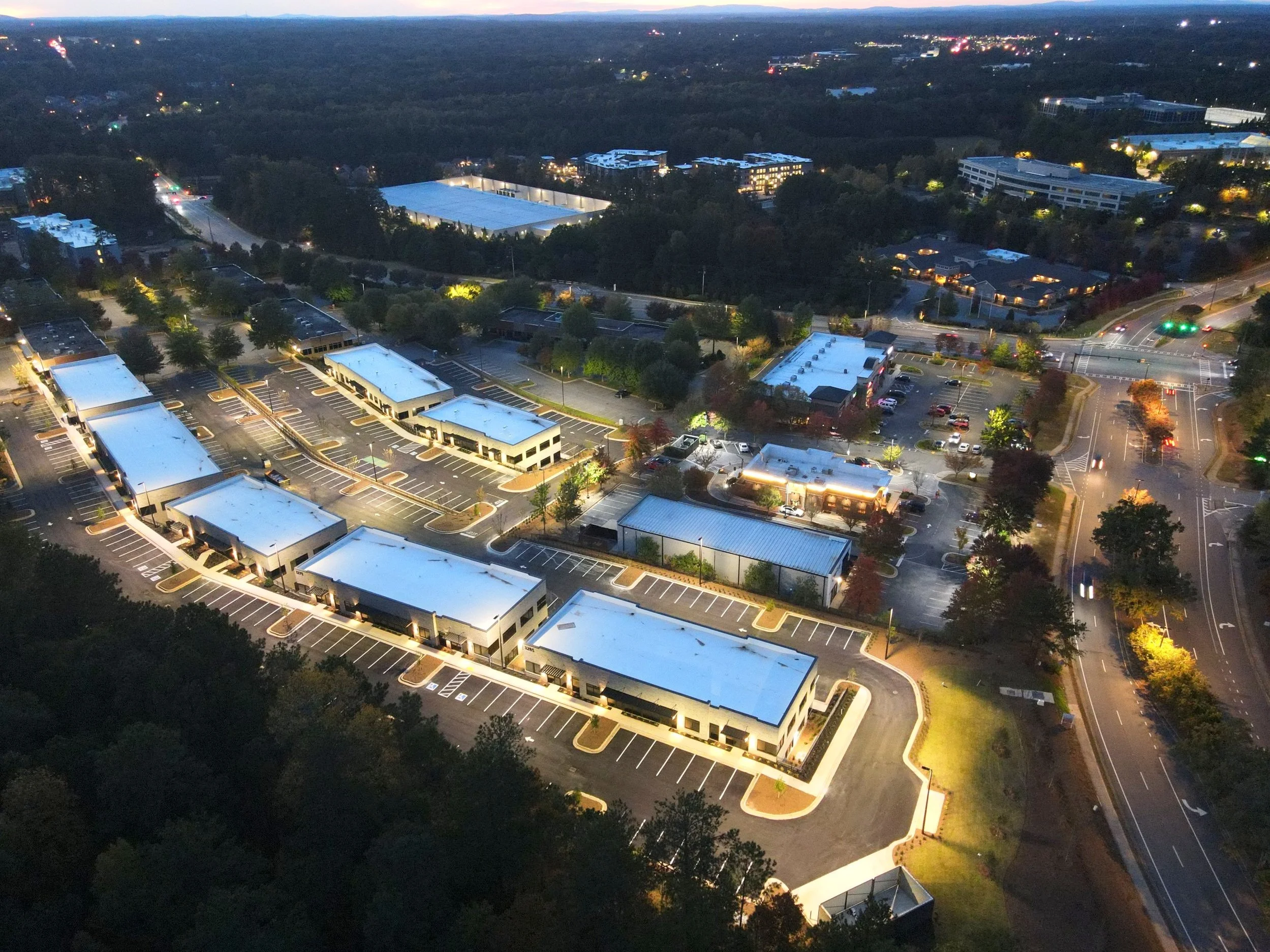 Aerial view of a commercial campus at dusk