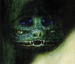 A dark, eerie image of a creature resembling a snarling, monstrous face with glowing blue eyes.