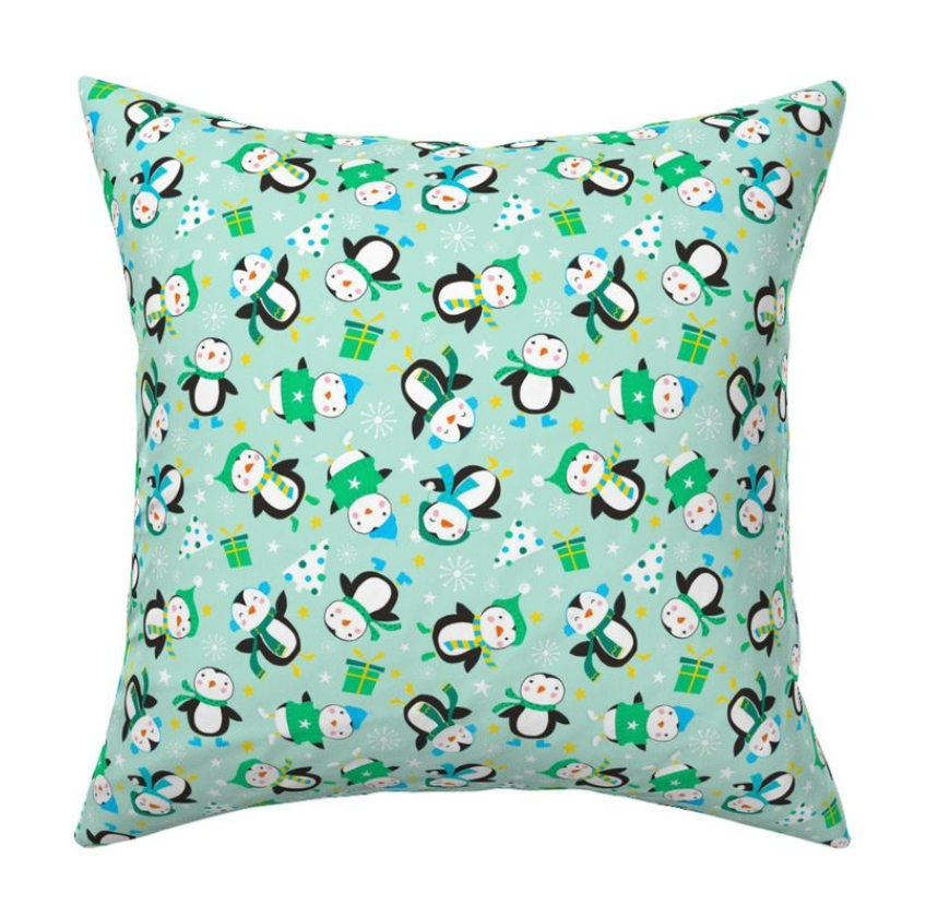 cute christmas penguins on light green fabric