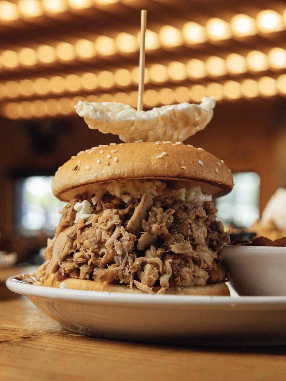 Elliott piles his signature whole-hog pulled pork high on his sandwhiches.