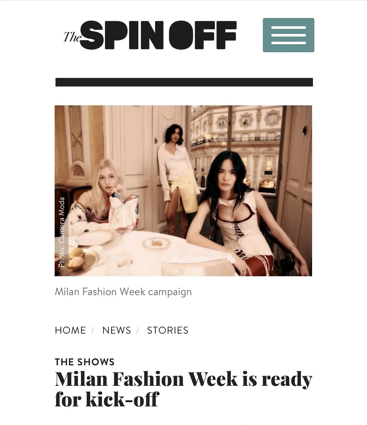 Photograph of three women at a dining table in an ornate, elegant restaurant with large windows and decorative architecture, promoting Milan Fashion Week campaign.