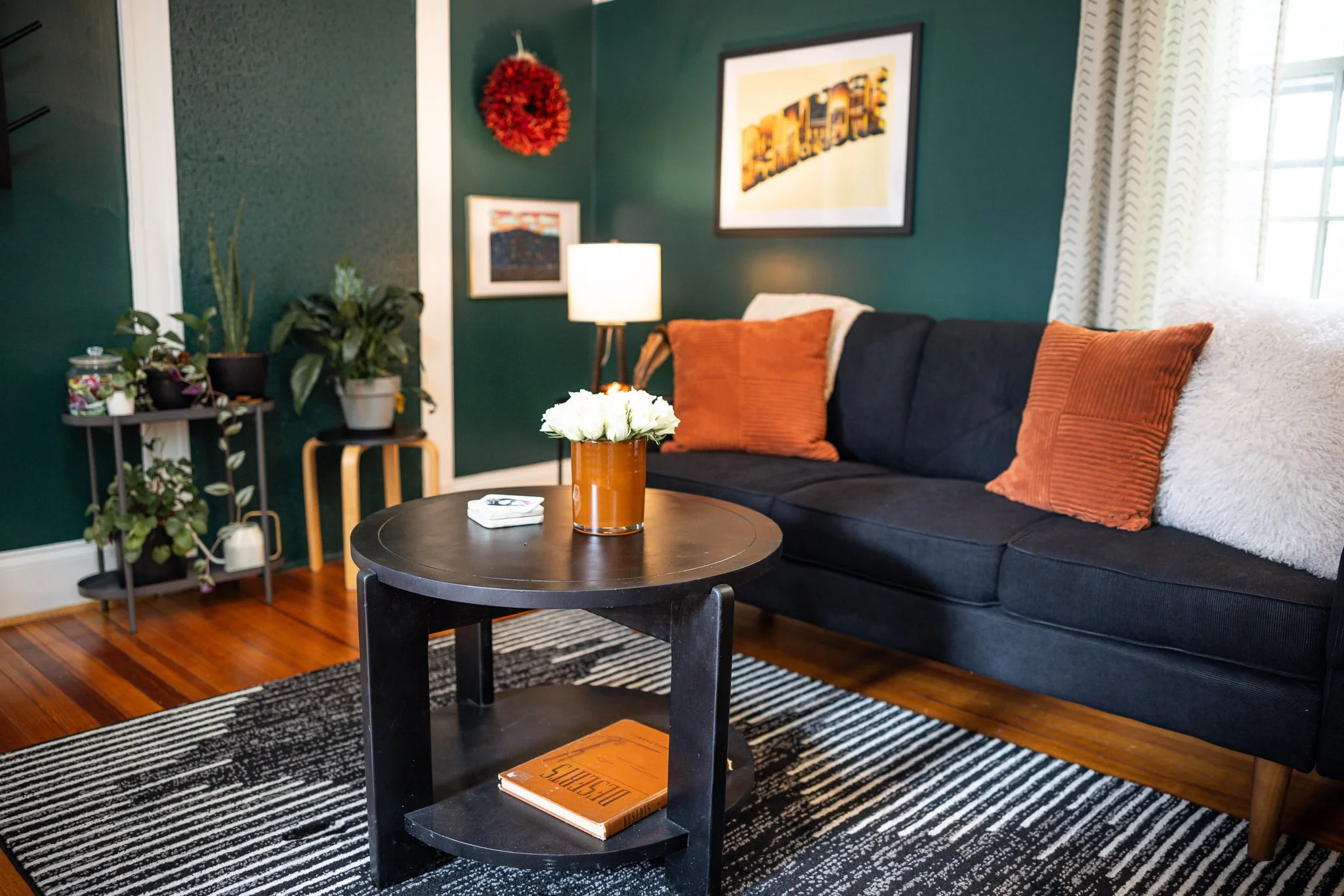 A picture of a individual and couple's therapist's couch - warm lighting, dark soothing colors.
