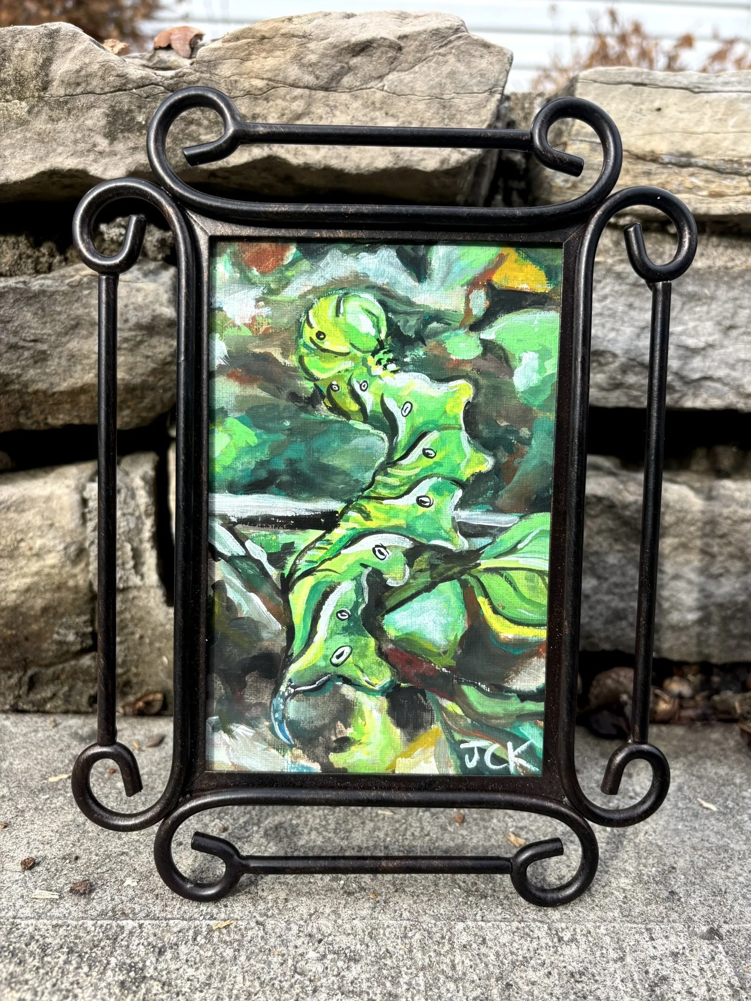 Paw Paw Sphinx, 2026, 4x6 inches gouache on canvas paper in a 6x8 inch thrifted frame