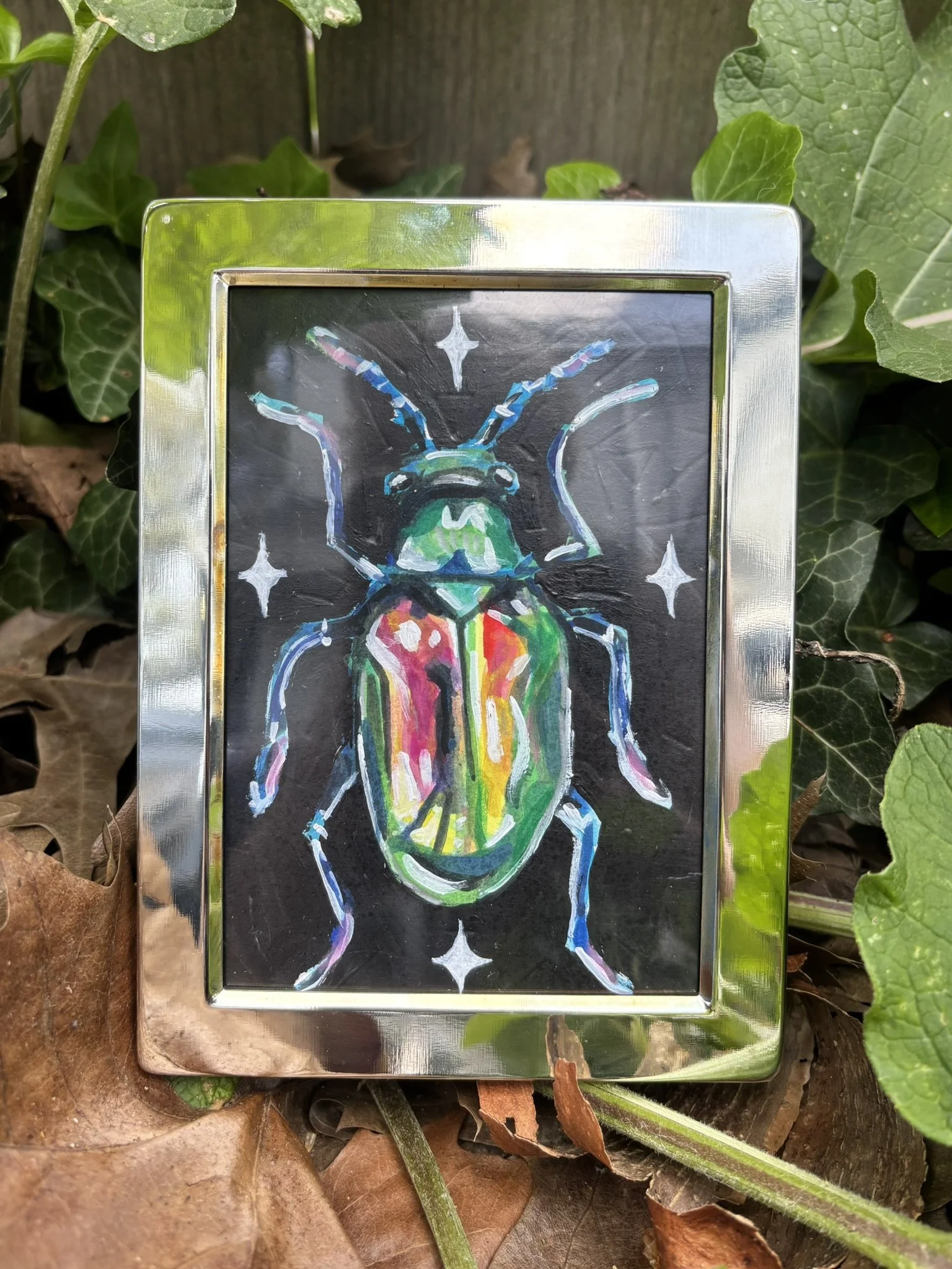 Dogbane Beetle, 2026, 3x5 inches, gouache on multimedia paper in a thrifted frame
