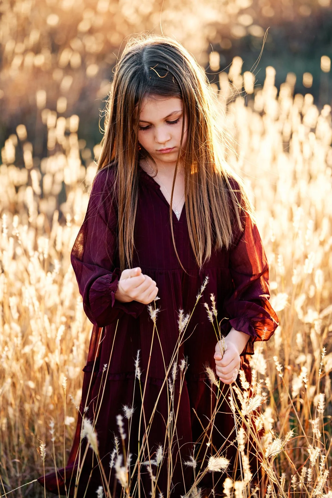 Golden hour young girl portrait in field.jpg