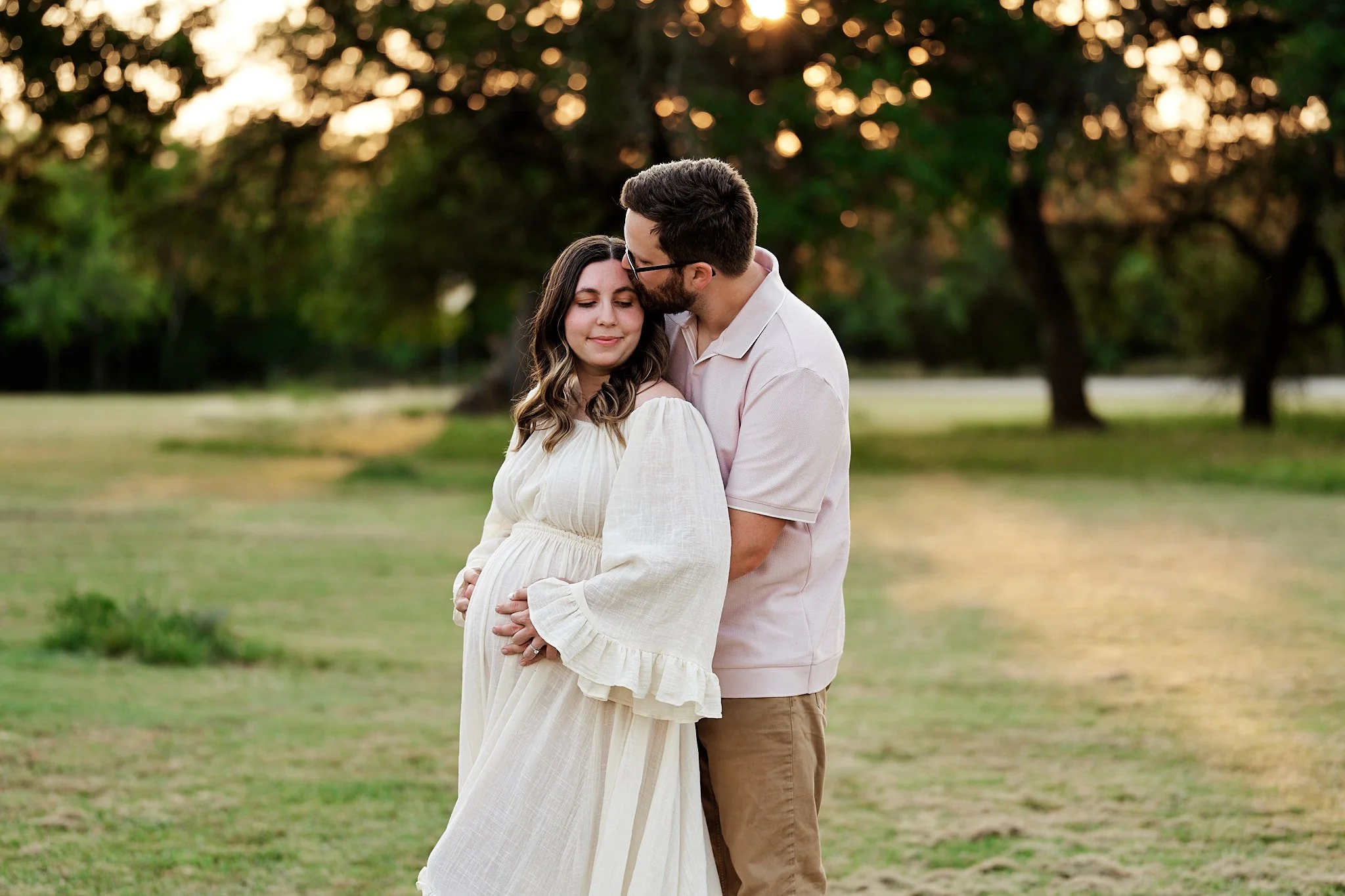 Outdoor Maternity Couples Portrait Kiss On head.jpg